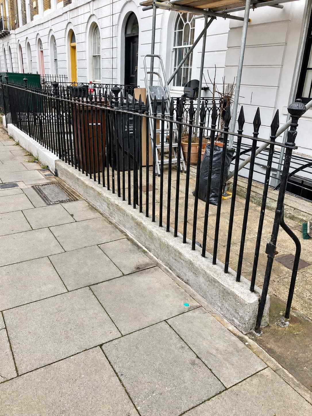 Railings and gate refitted to the front wall after restoration, Shepherdess Walk N1