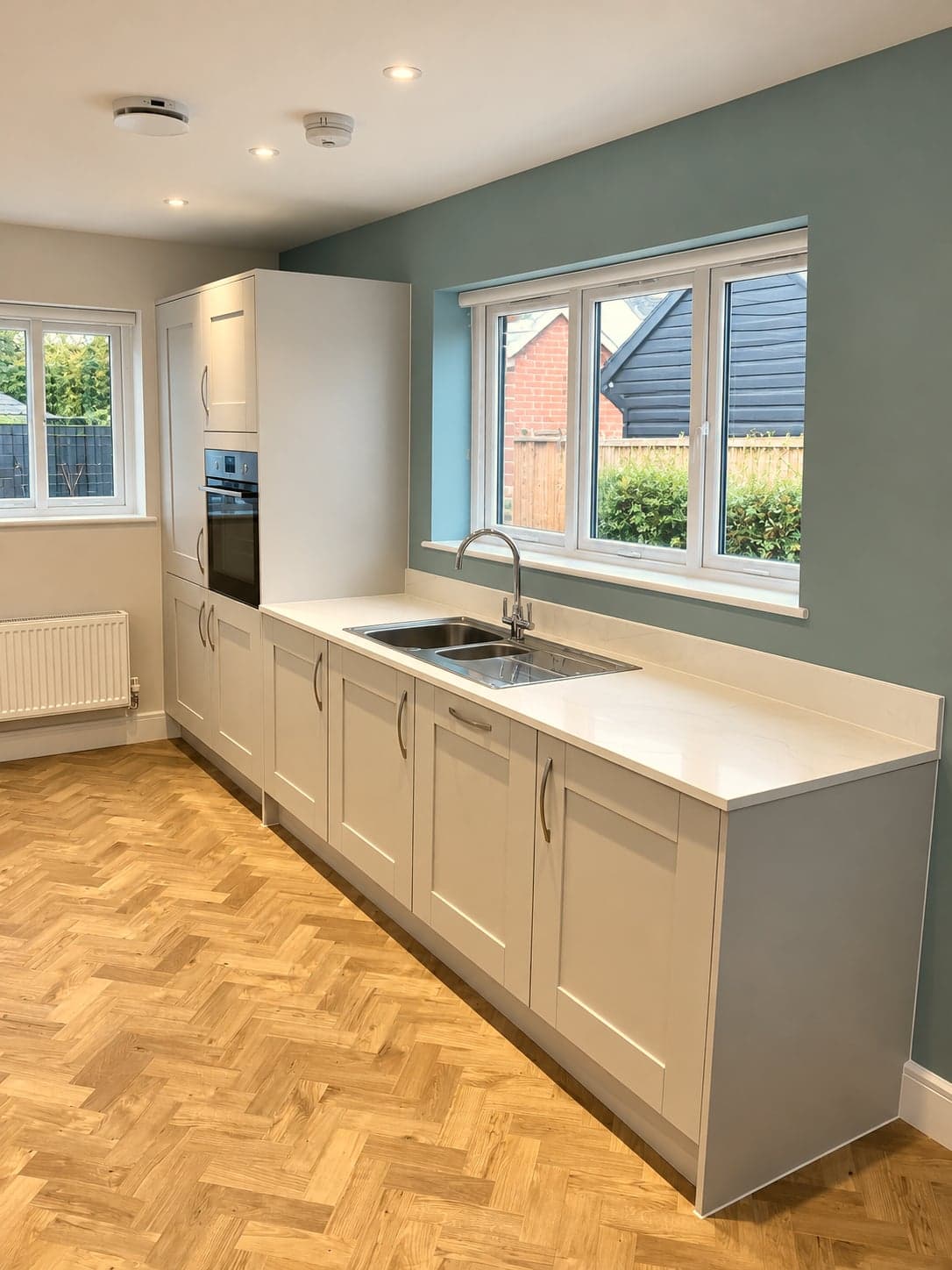 Window run with inset sink and the island alongside, Amersham HP6