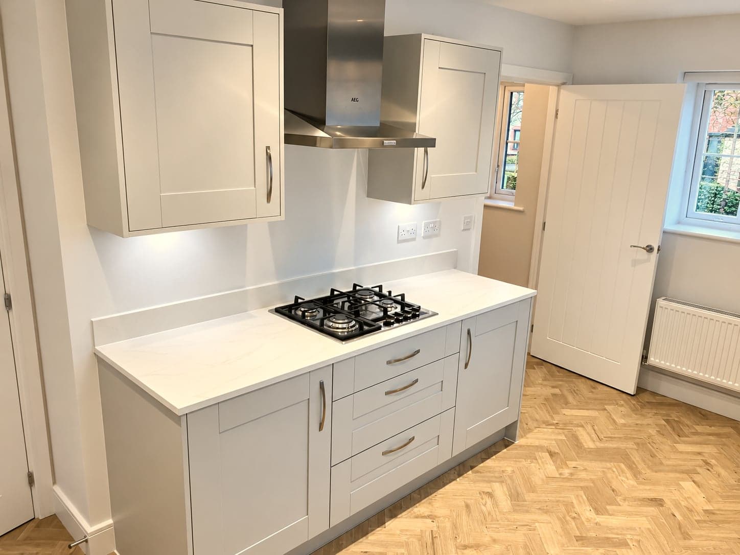 Gas hob and extractor with the utility door beyond, Amersham HP6