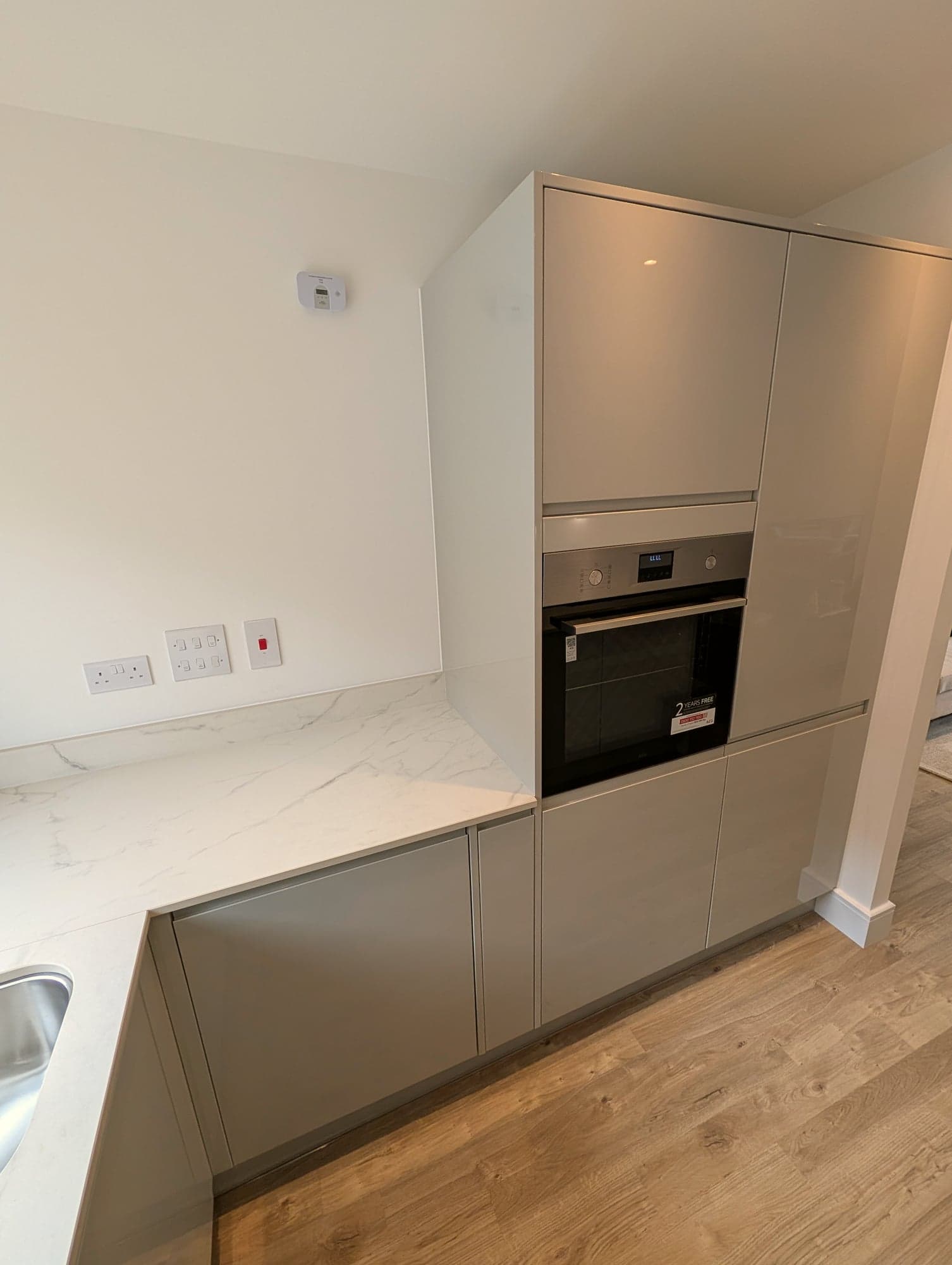 Integrated oven set into the tall handleless housing, Barnet EN5