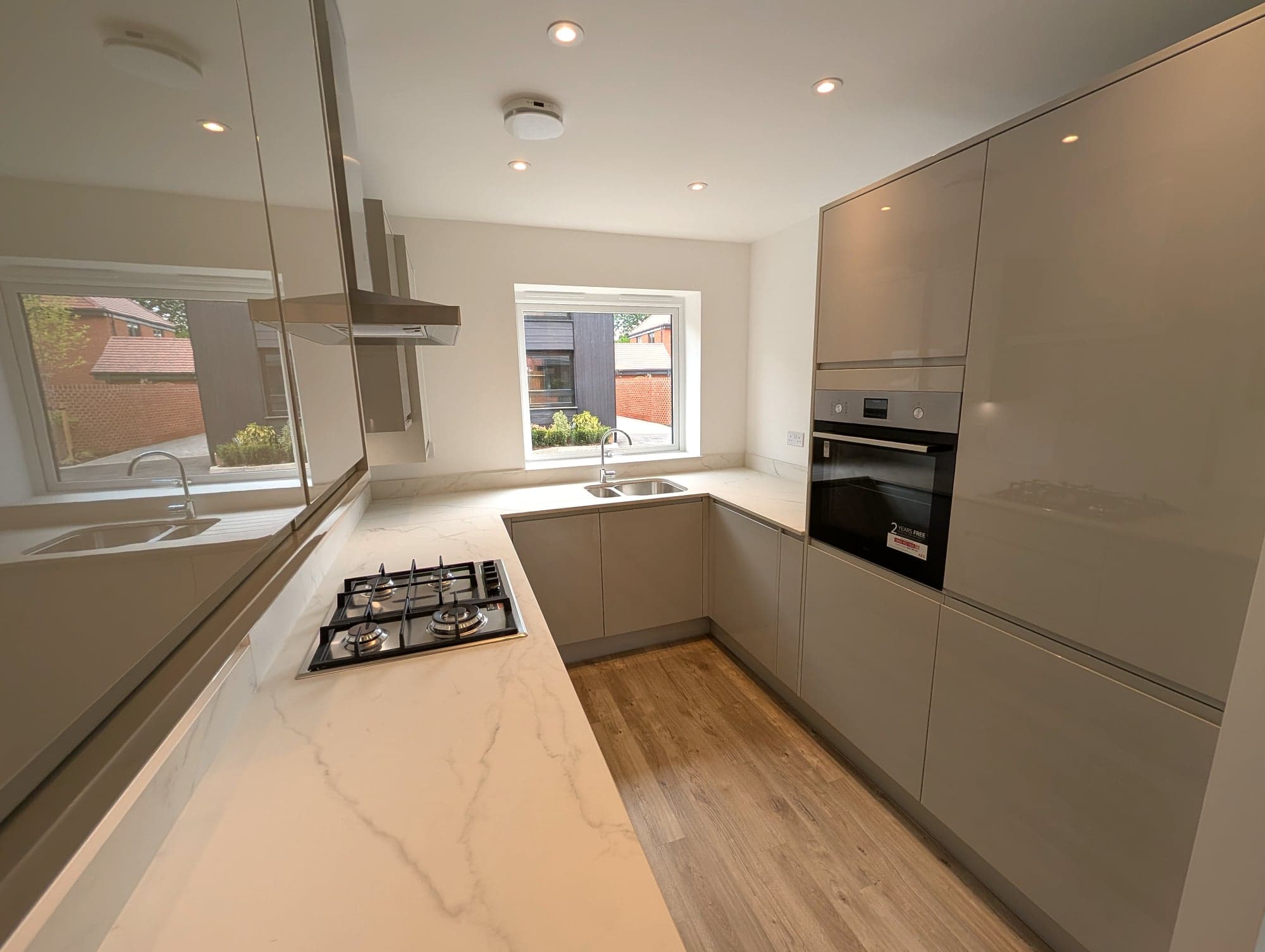 Kitchen from the far end: hob run, sink and oven tower, Barnet EN5