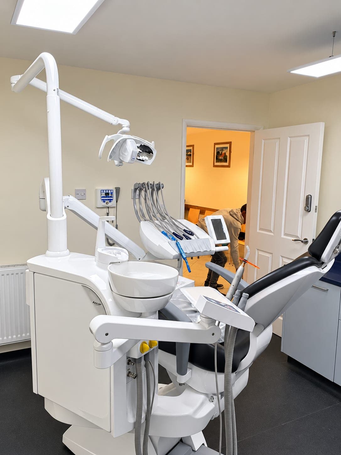Dental chair and delivery unit with the corridor beyond, Haverhill CB9