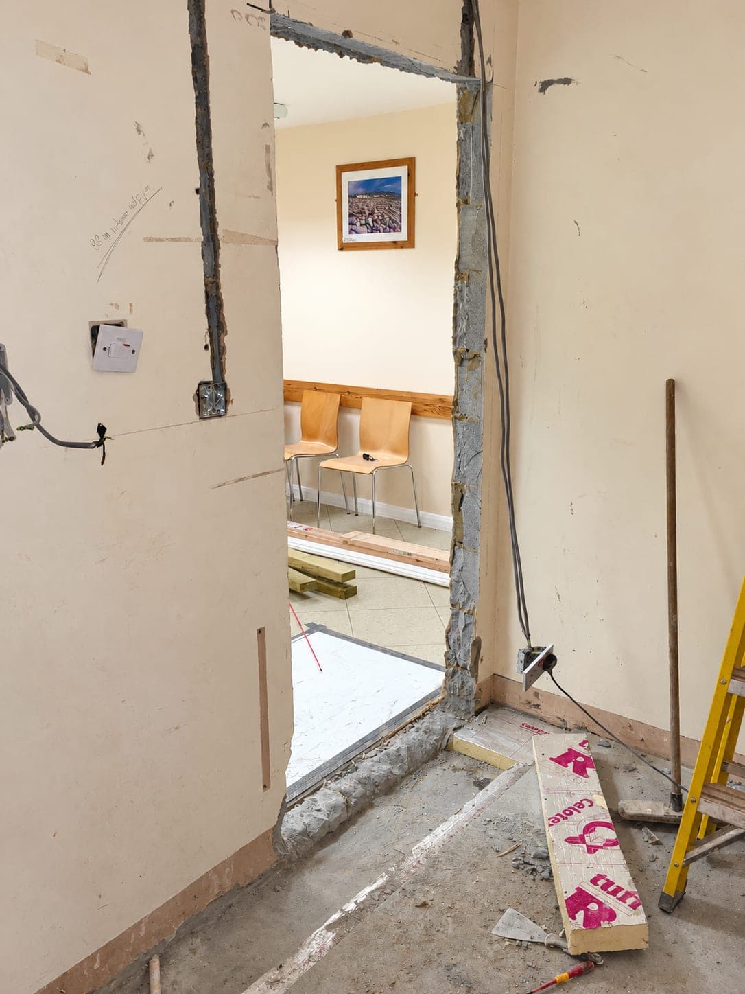 New opening cut through the wall to connect the rooms, Haverhill CB9