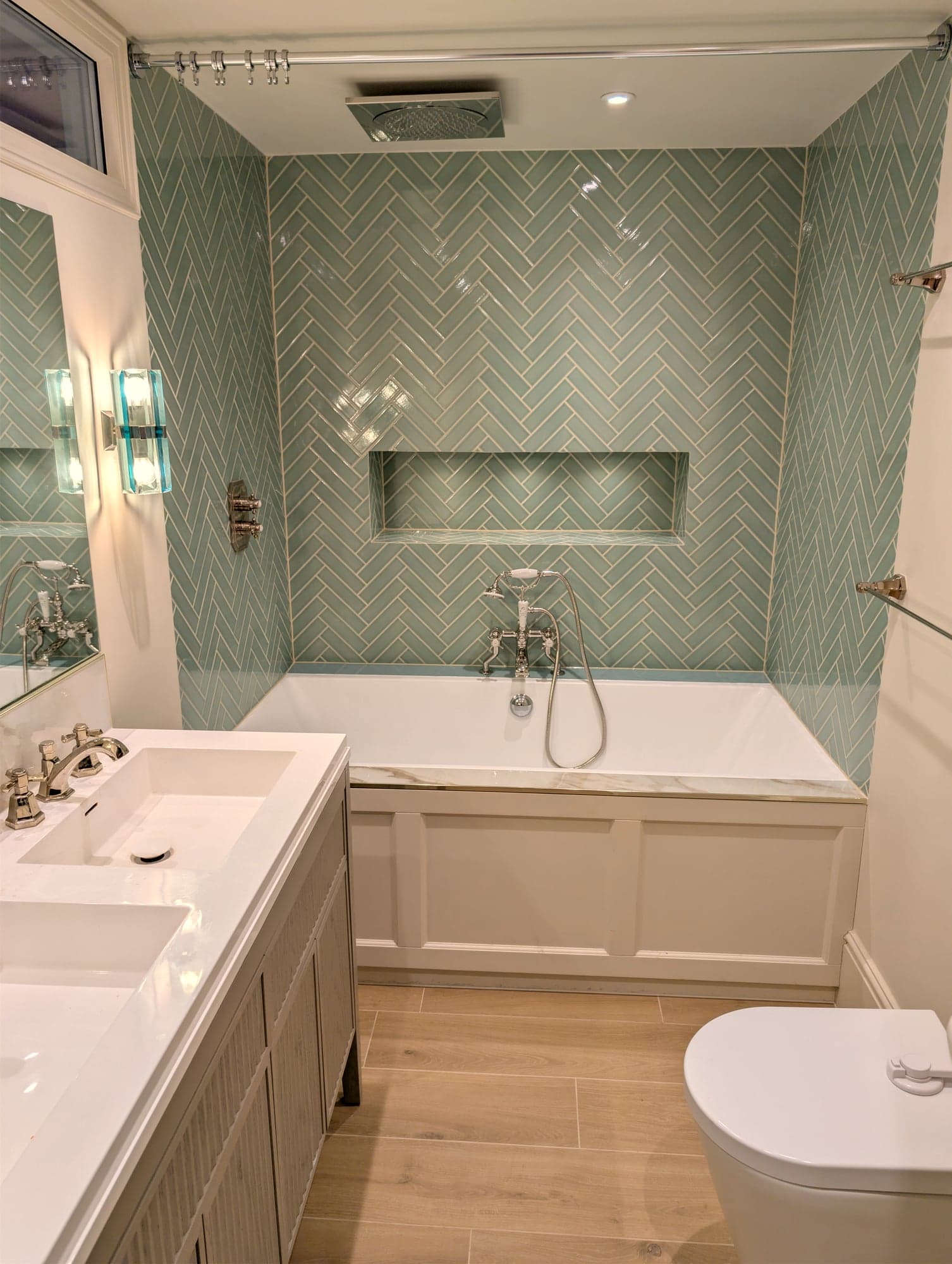 Bathroom looking across the double vanity to the bath and WC, oak flooring throughout, Fulham SW6