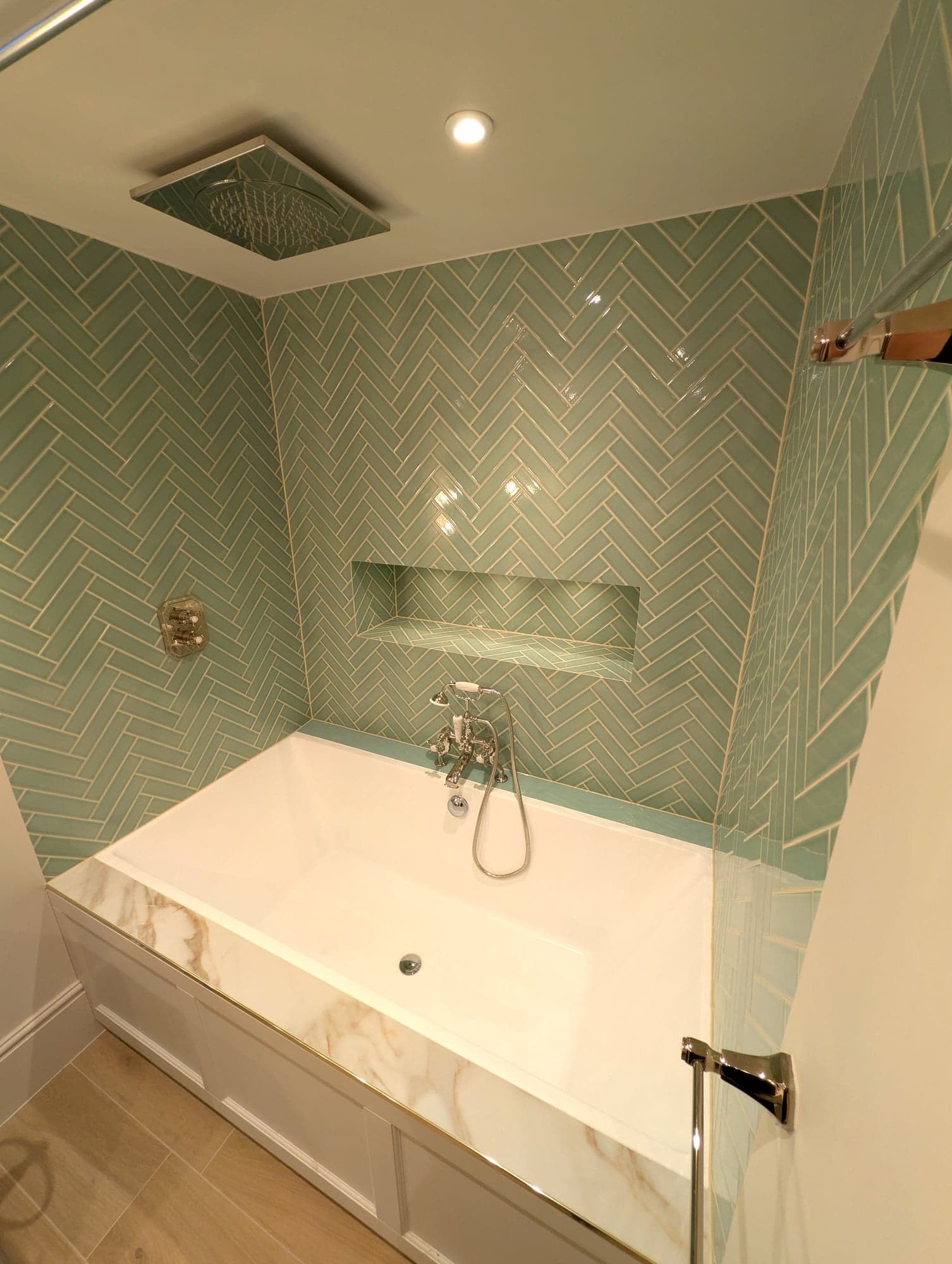 Side view of the panelled bath and marble top with ceiling extractor above, Fulham SW6