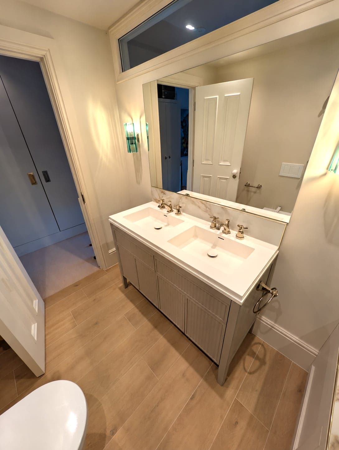 Double vanity and mirror from the doorway with the blue painted door beyond, Fulham SW6