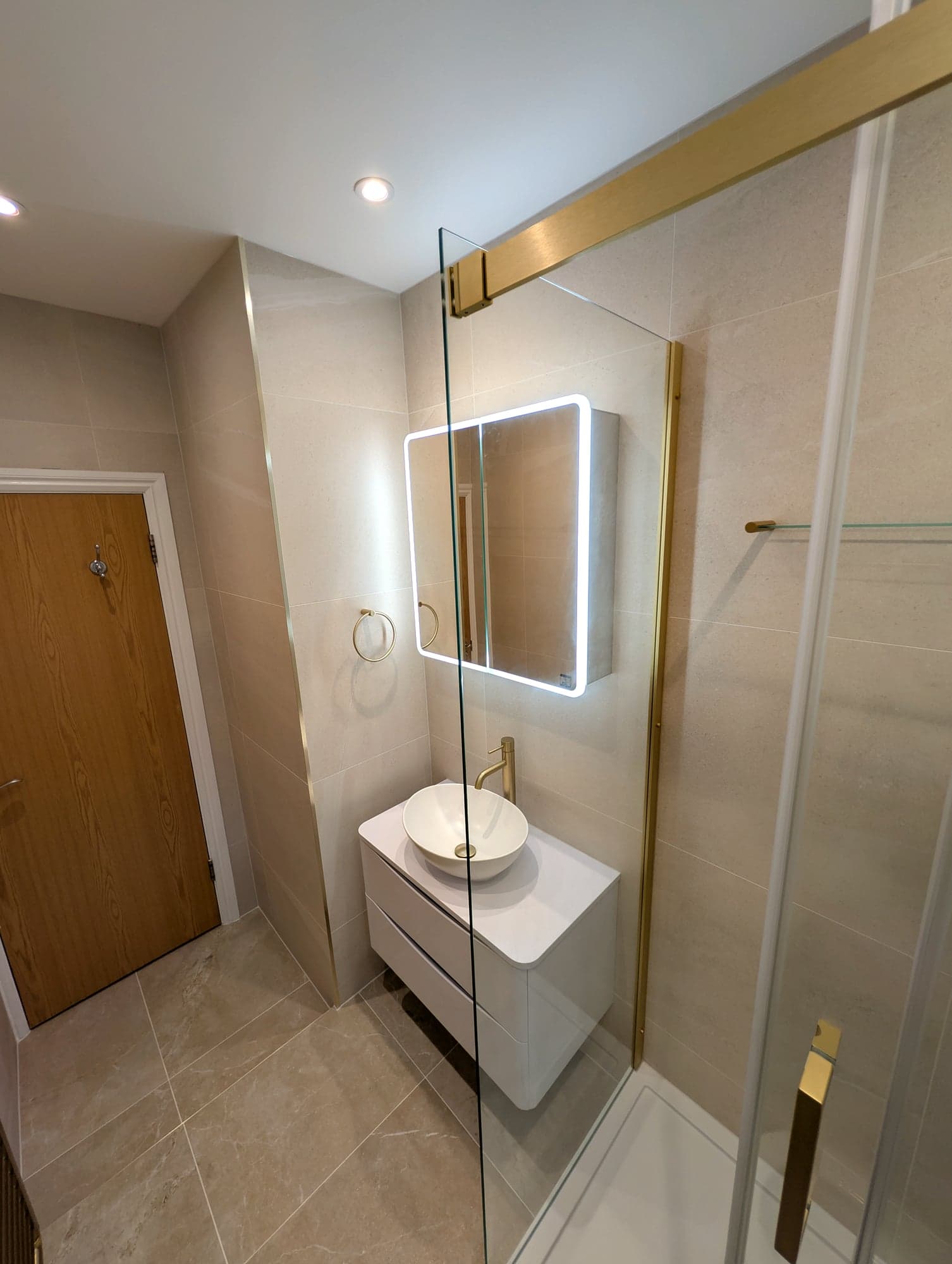 Vanity and shower seen from the bedroom door, Nine Elms SW8