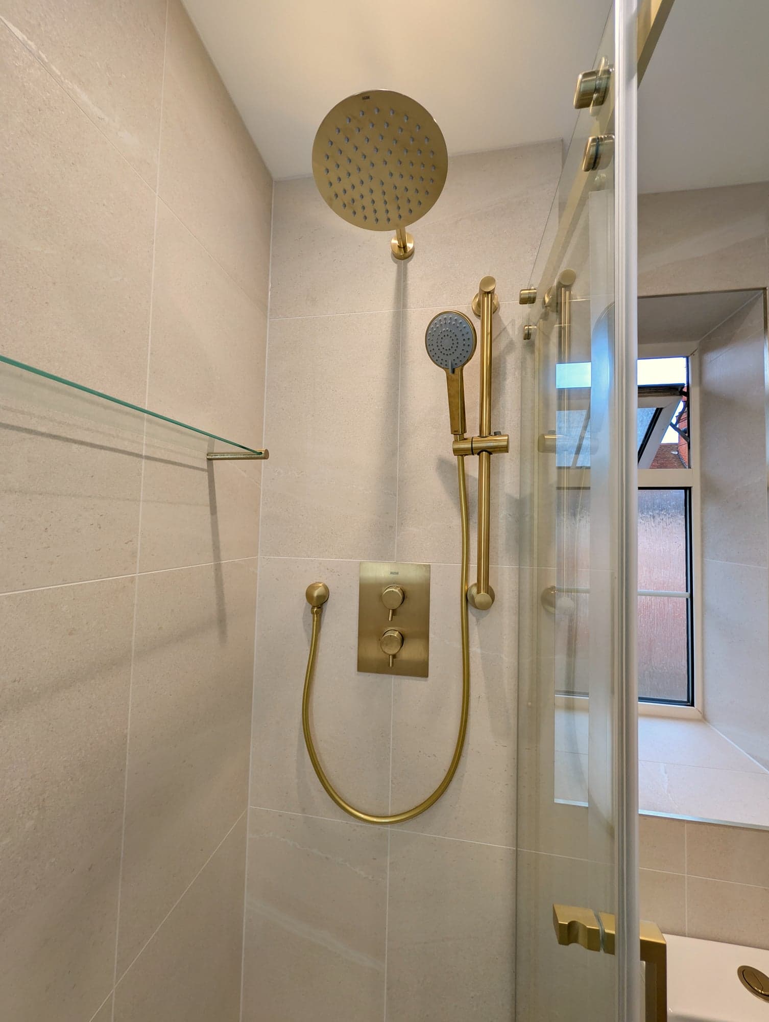 Brass rainfall head, handset and concealed valve inside the shower, Nine Elms SW8