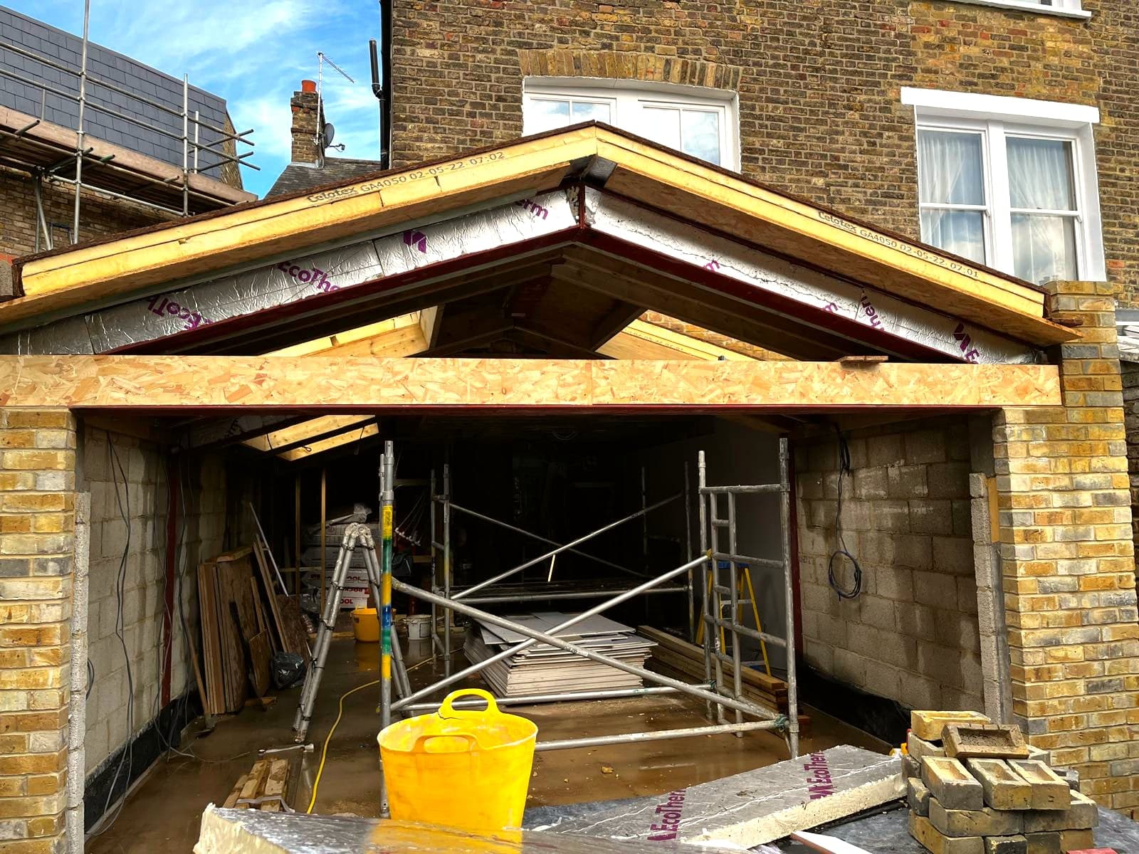 Extension roof structure and brickwork seen from outside, St Albans AL1