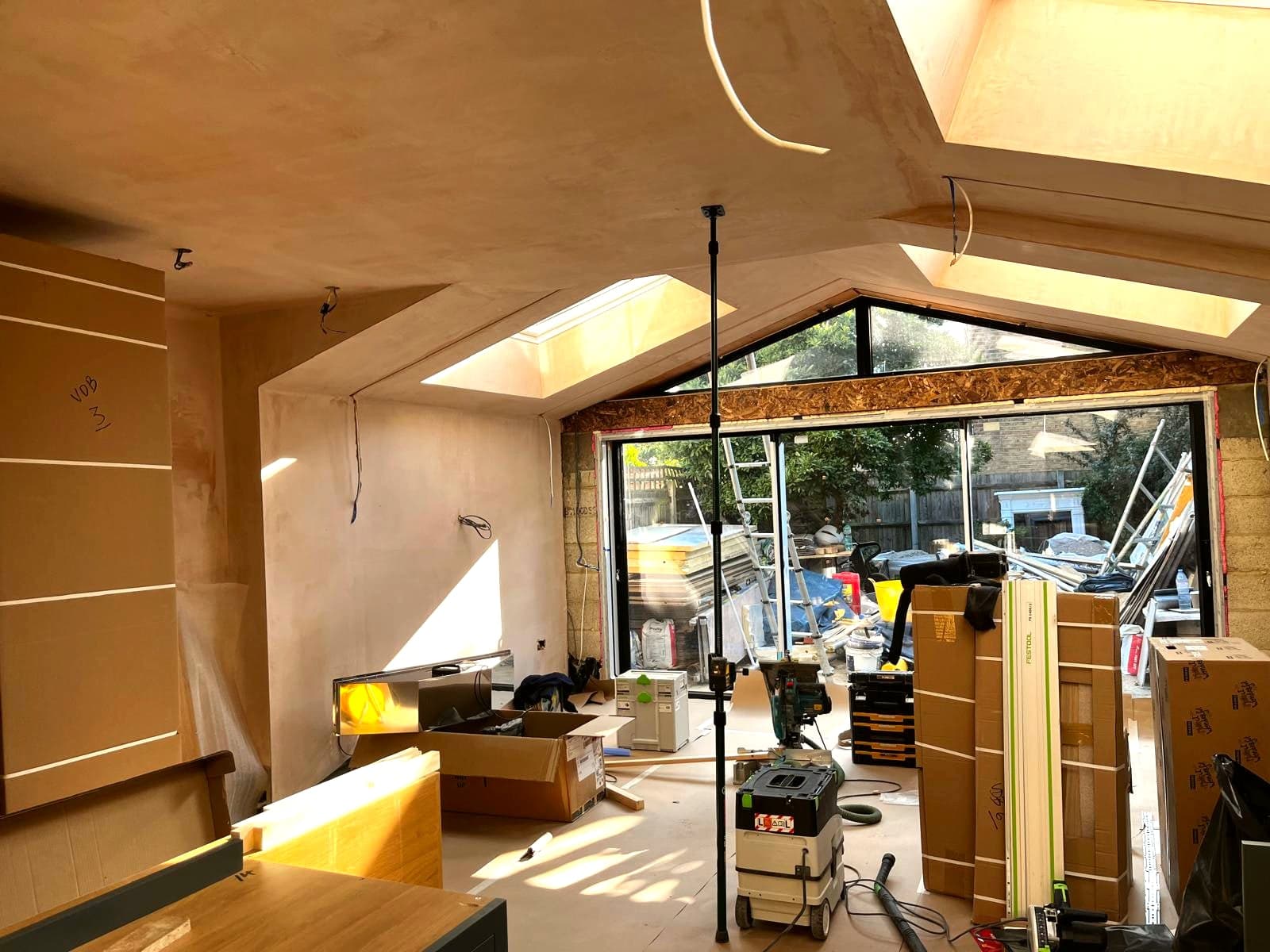 Kitchen units going in against the new oak floor and bi-folds, St Albans AL1