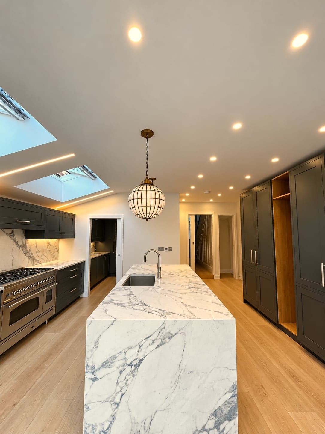Luxury kitchen extension with waterfall marble island and skylights, St Albans AL1