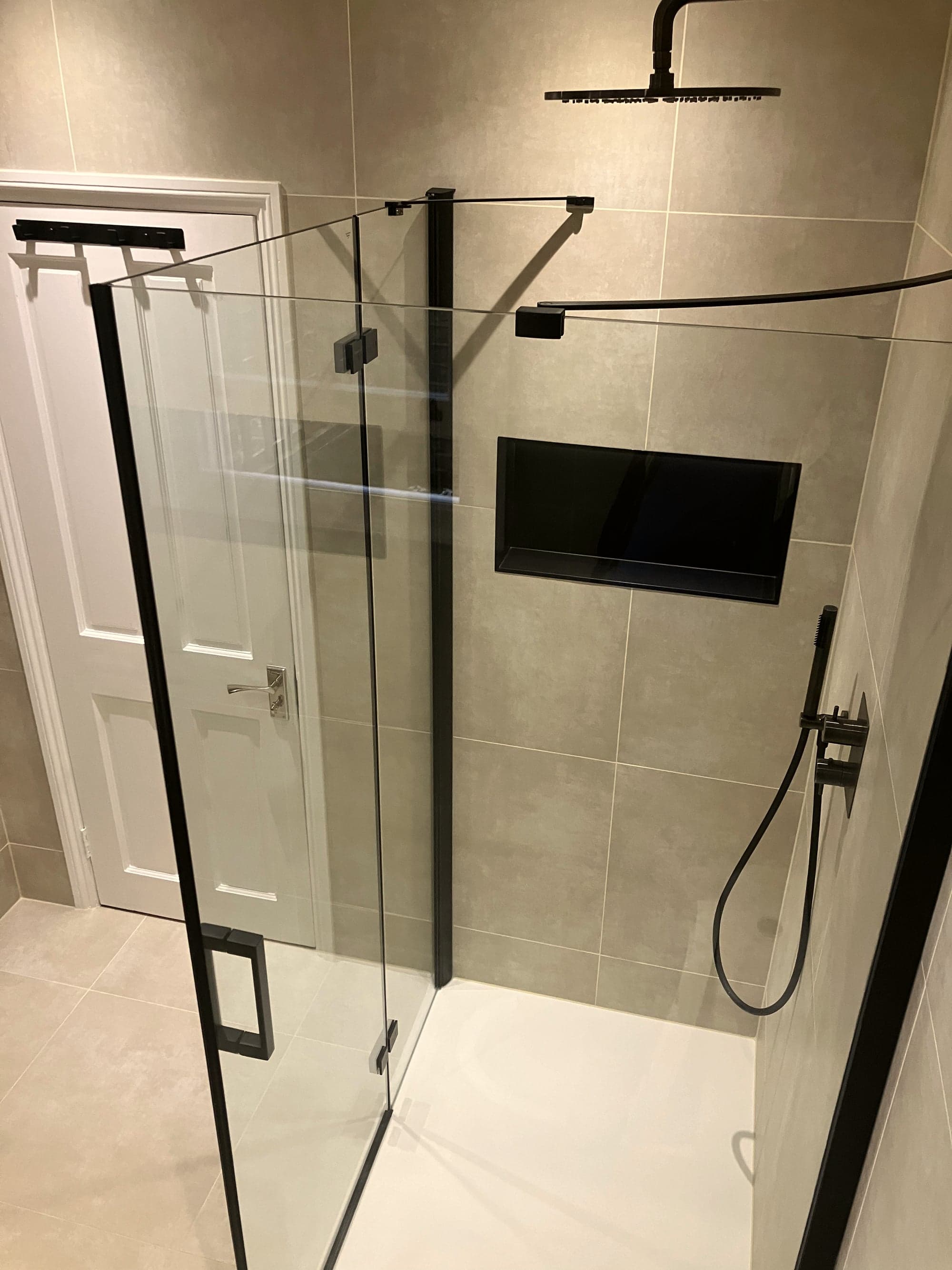 Shower enclosure with black-framed glass screen and black brassware, Clapham Common SW4