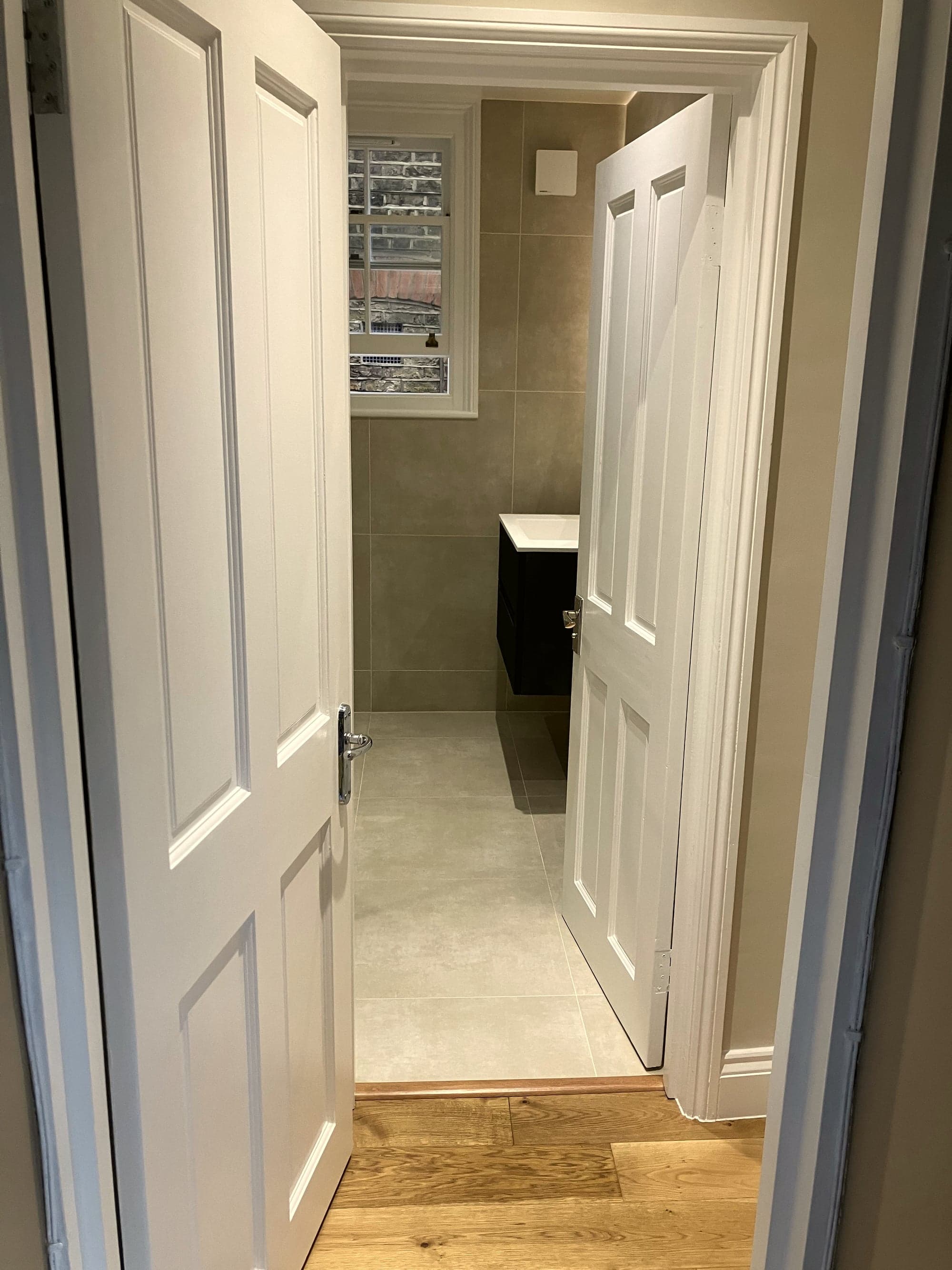 Looking through from the landing into the finished shower room, Clapham Common SW4