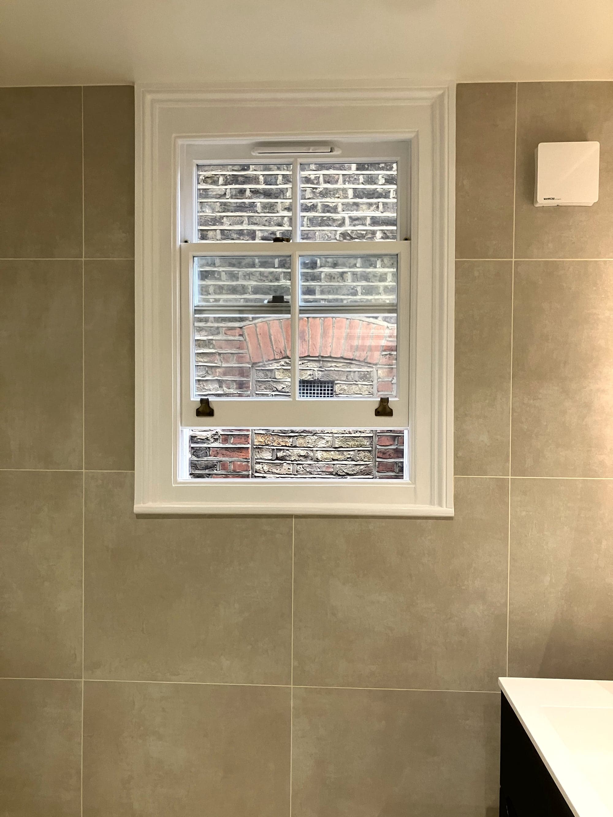 Sash window set into the tiled wall above the vanity, Clapham Common SW4