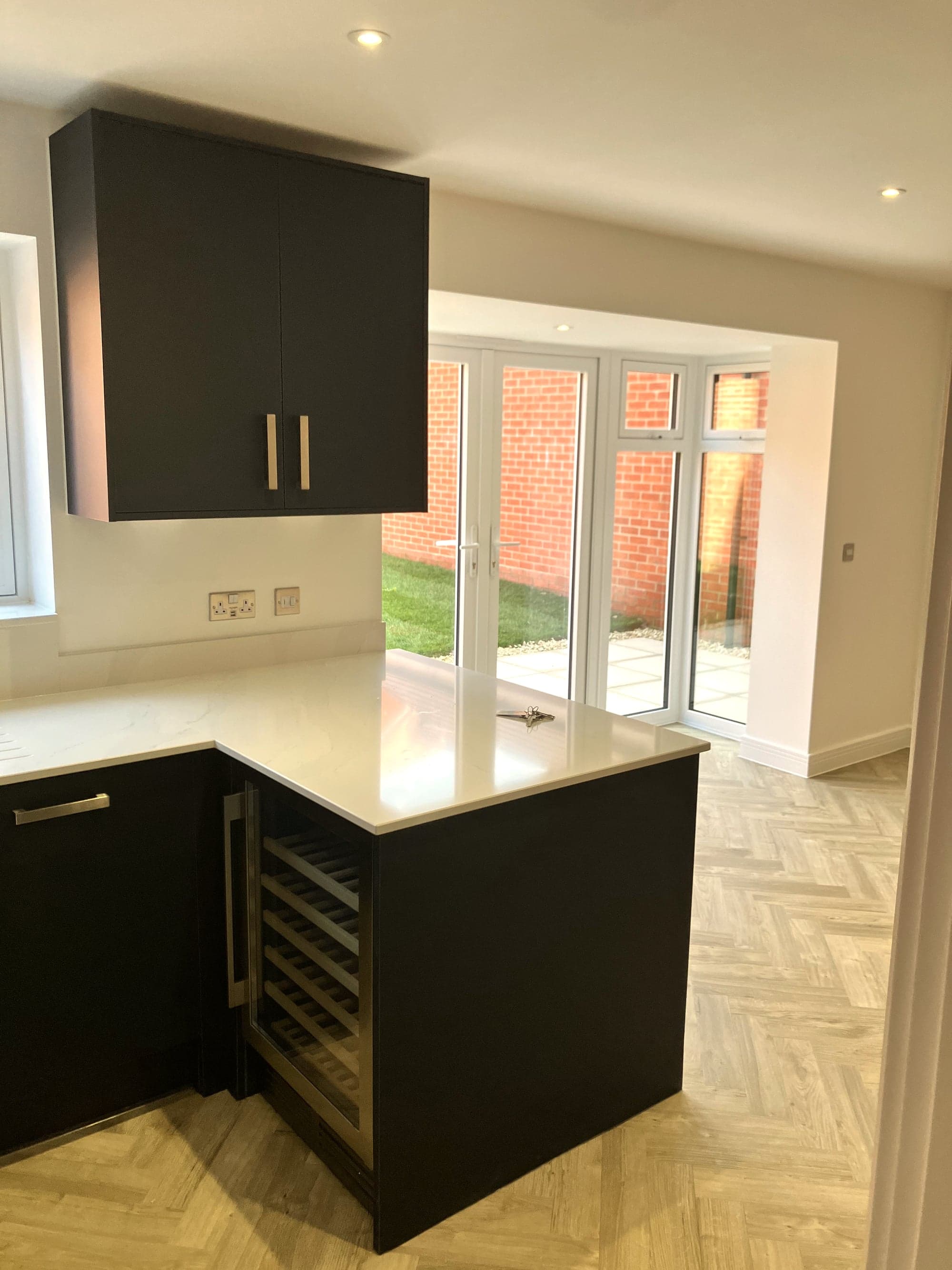 Peninsula with integrated wine cooler beside the garden doors, Hampstead NW3