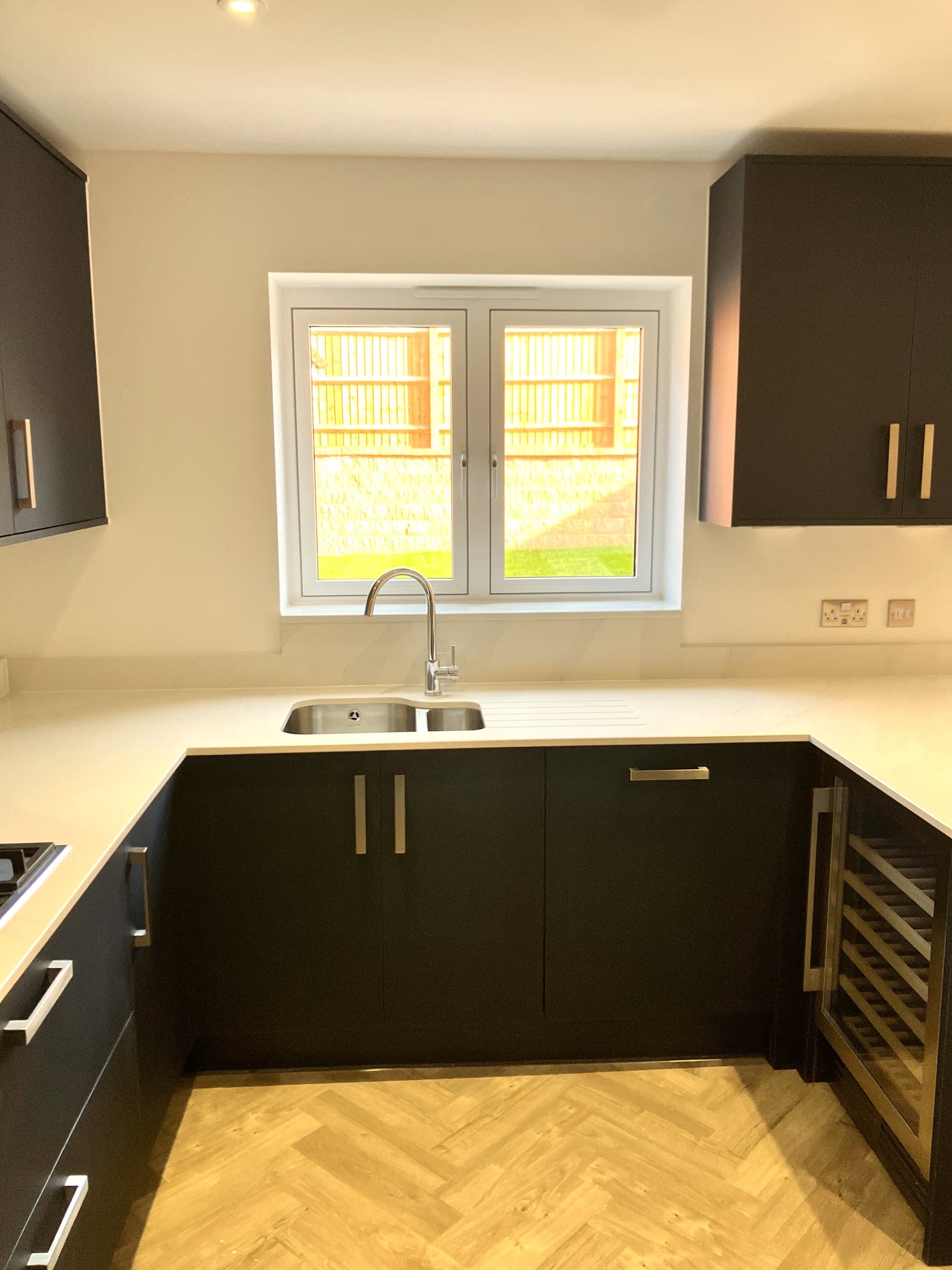 Sink run below the window with wall units either side, Hampstead NW3