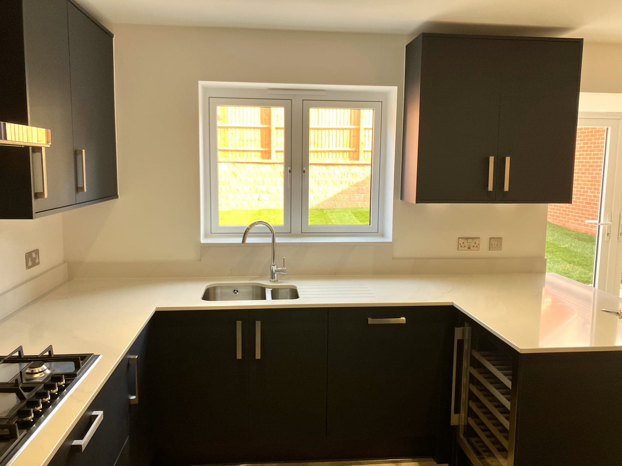 Kitchen from the hob end looking to the sink and garden doors, Hampstead NW3