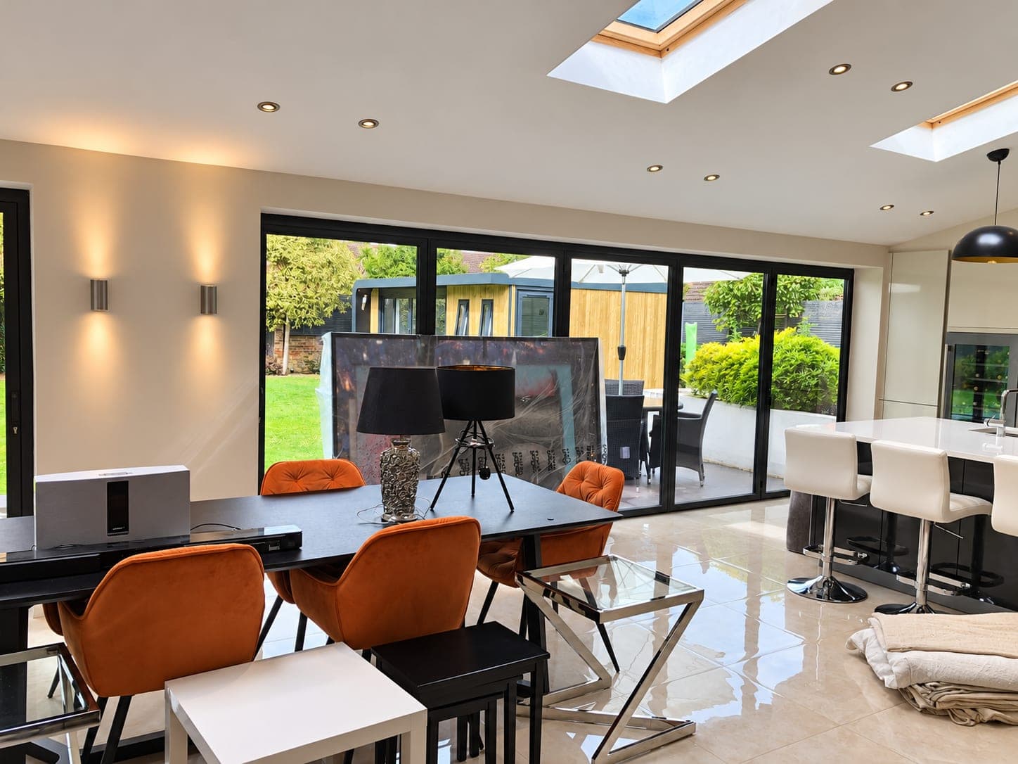 Open-plan kitchen and dining area painted out under a vaulted ceiling, Richmond TW9