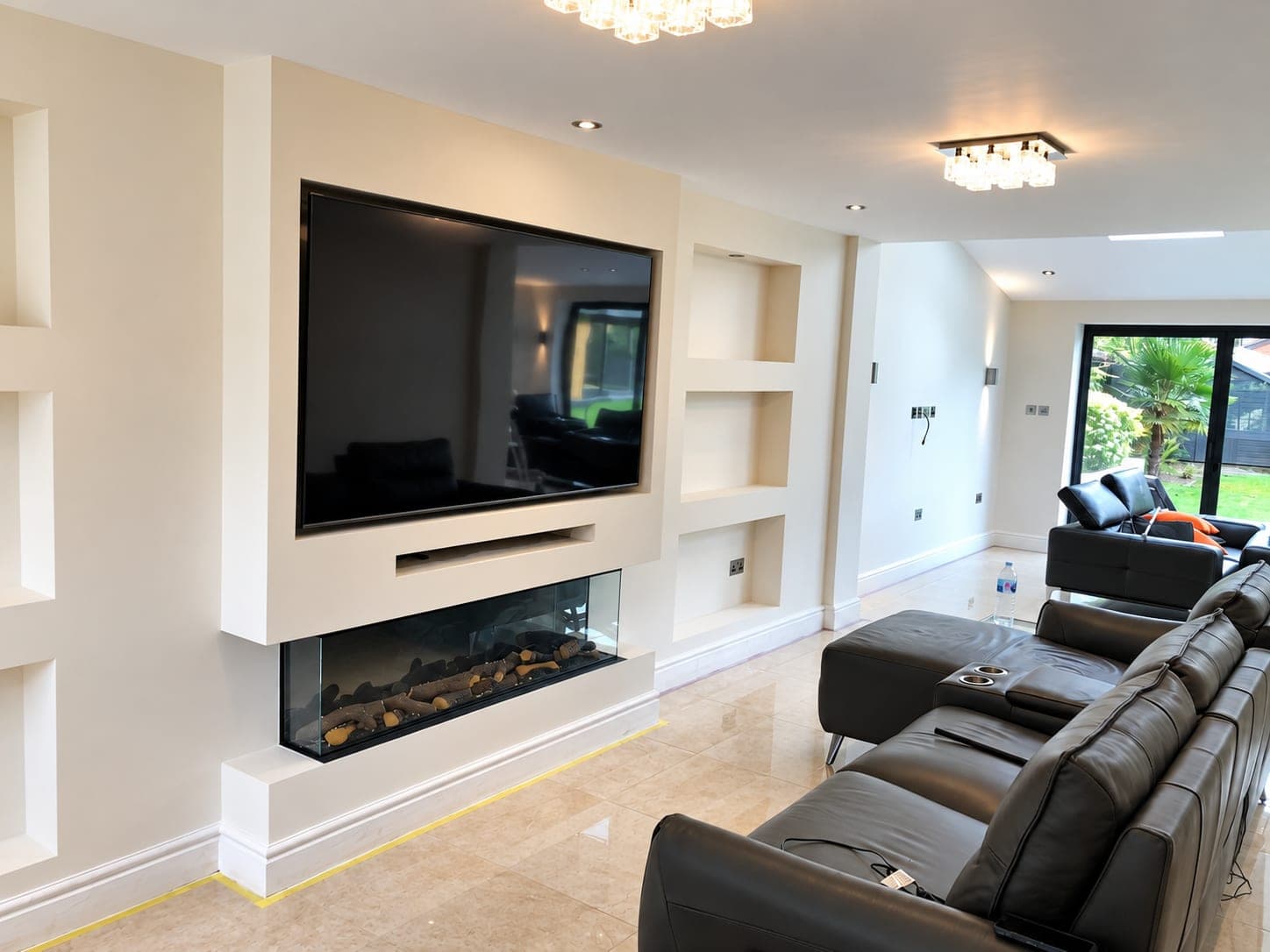 Built-in media wall with fireplace and shelving, cut in by hand, Richmond TW9