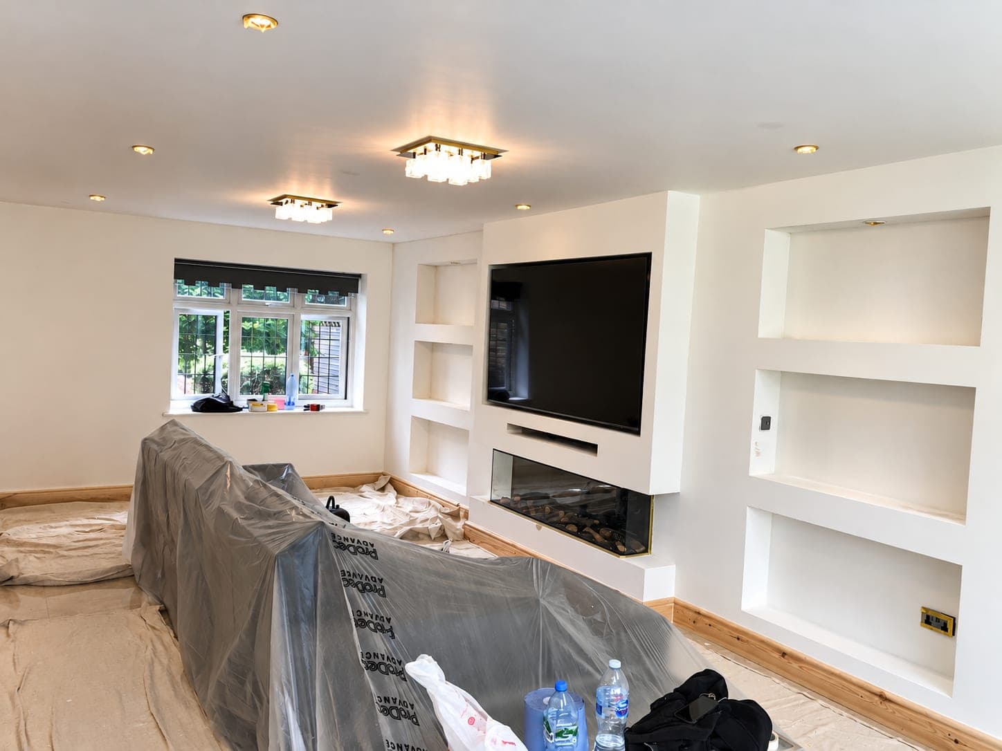 Decorating under way with the furniture sheeted and left in place, Richmond TW9