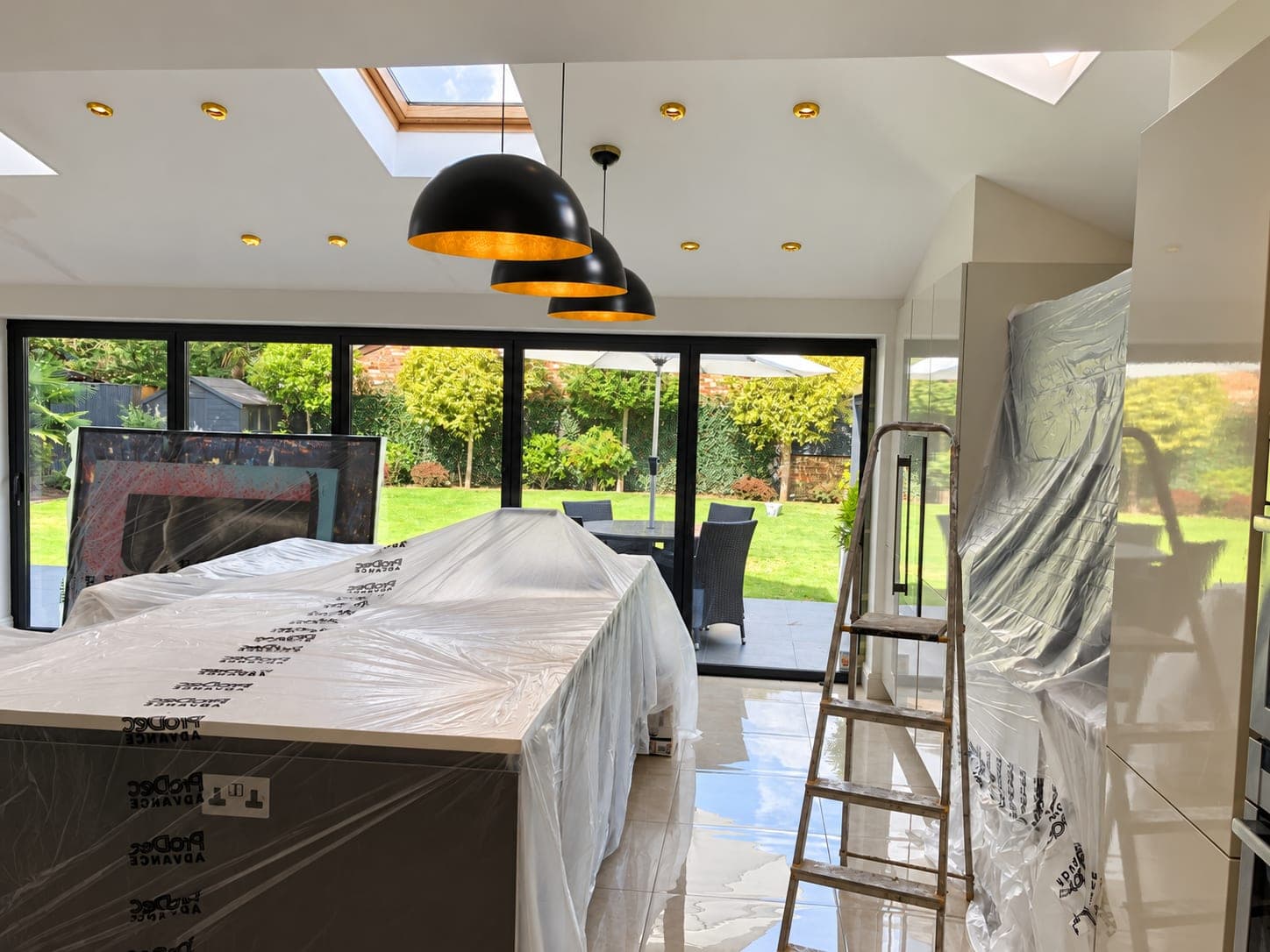 Kitchen island and furniture sheeted and masked ready for decorating, Richmond TW9