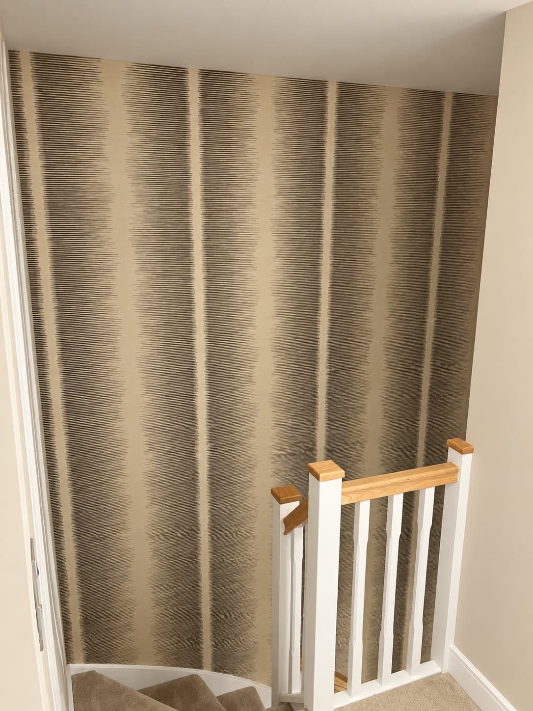 Wallpaper pattern matched around a staircase turn, London