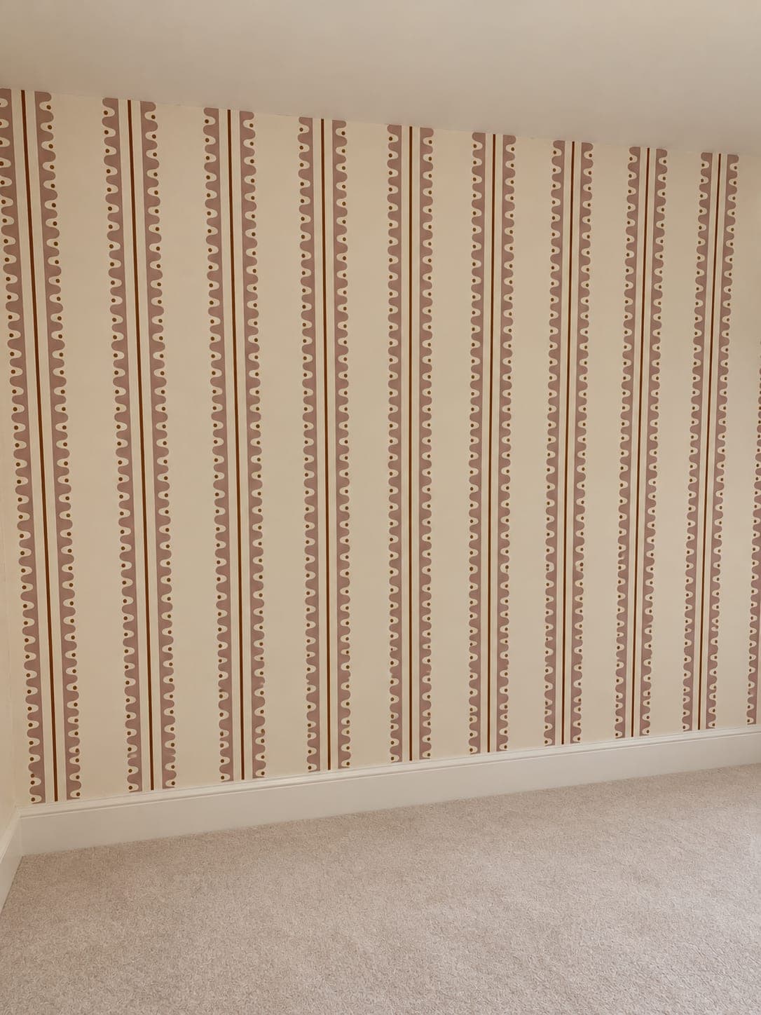 Striped paper hung level around the landing walls, London Colney AL2