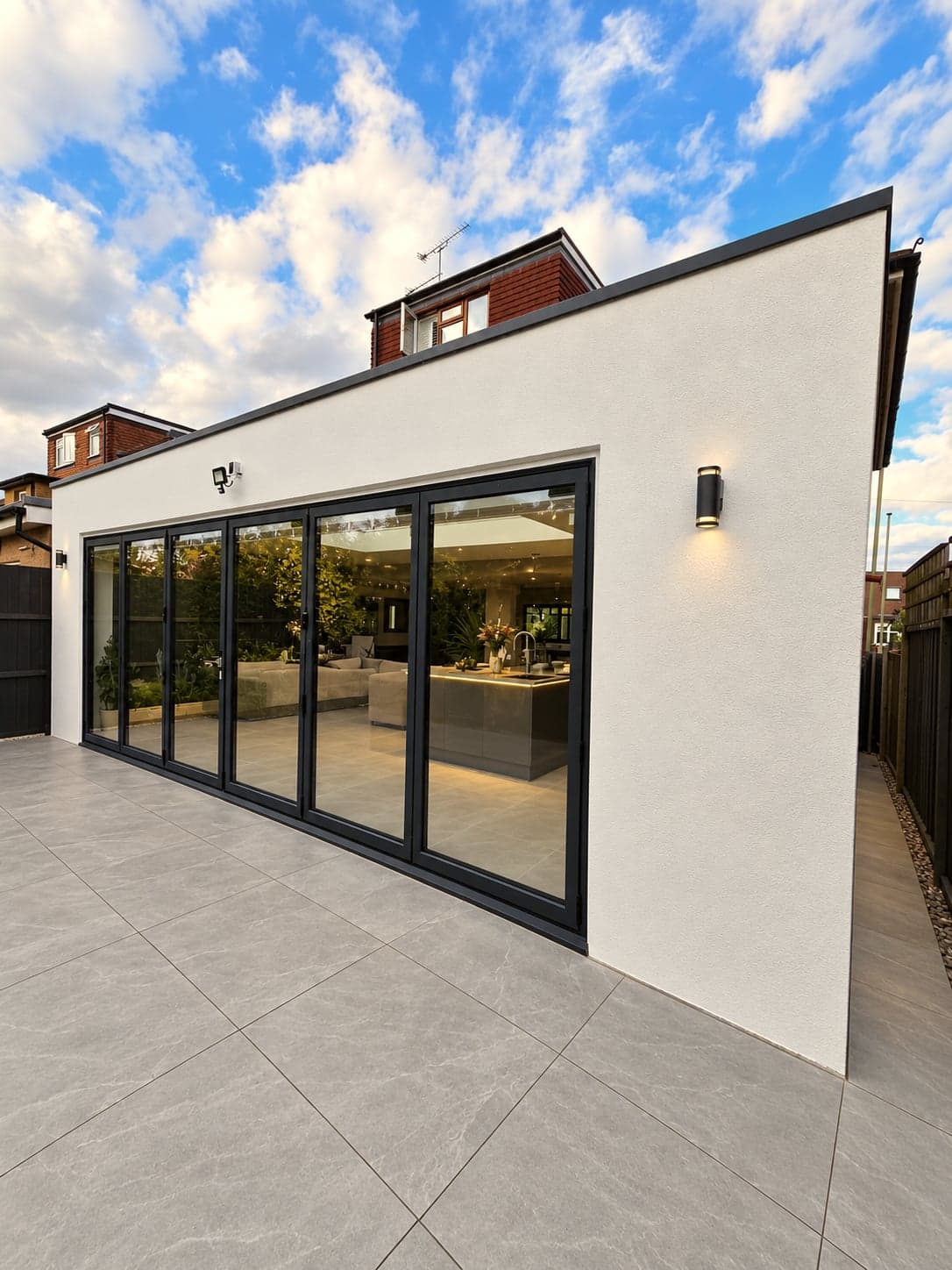 Rear extension and patio in full daylight, sliding doors closed, High Barnet EN5