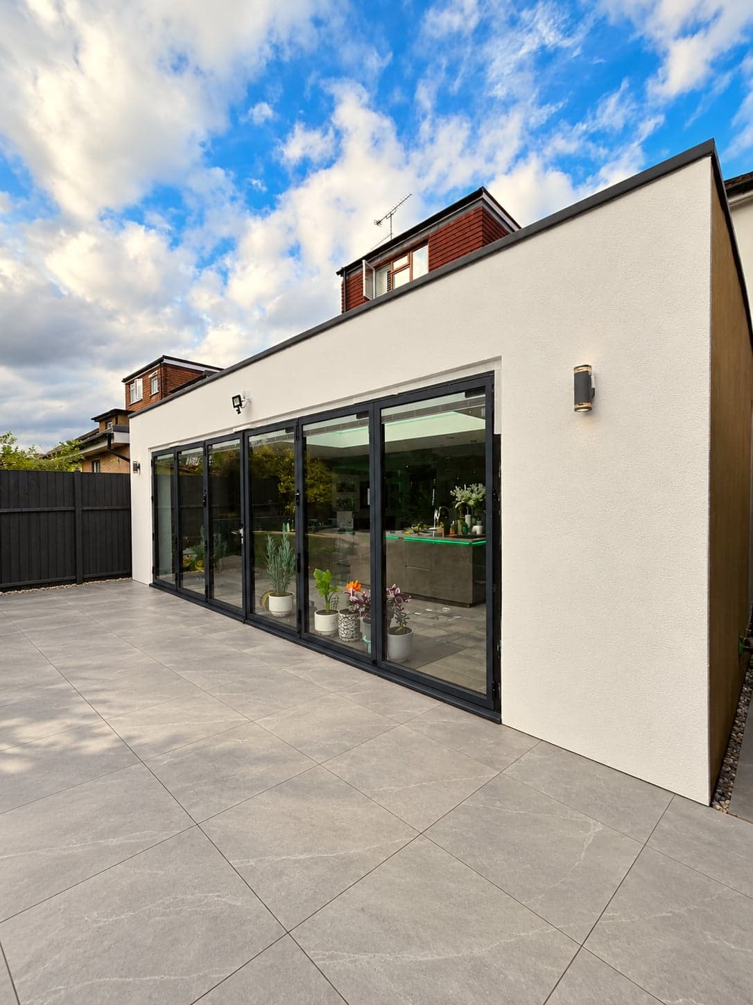 Wide rear elevation of the new extension with slim-framed sliding doors, High Barnet EN5