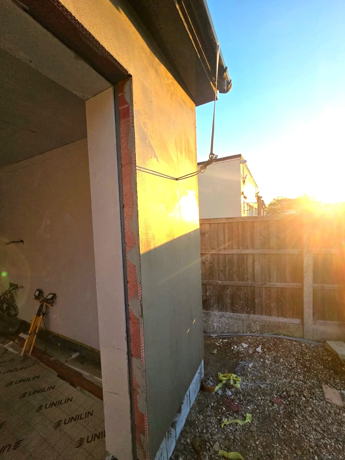 Side return of the extension during the build, late afternoon sun on the blockwork, High Barnet EN5