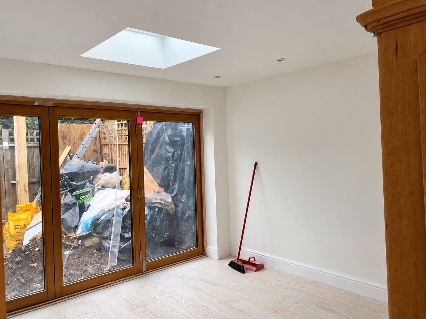 Finished rear extension with oak French doors, rooflight and engineered wood flooring, Stanmore HA7