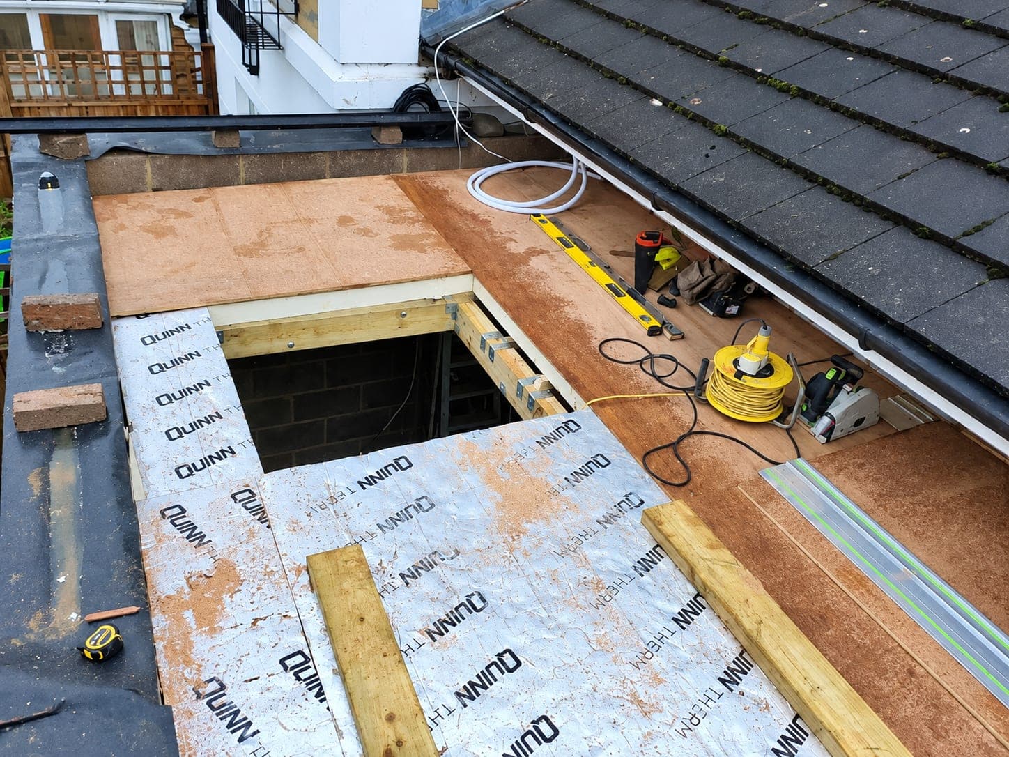 Insulation boards laid over the roof deck around the rooflight opening, Stanmore HA7