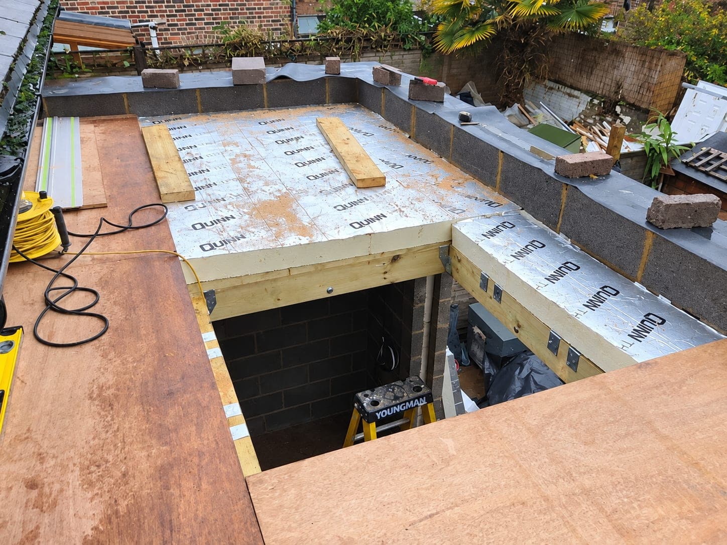 Roof deck and insulation seen from above with the opening formed, Stanmore HA7