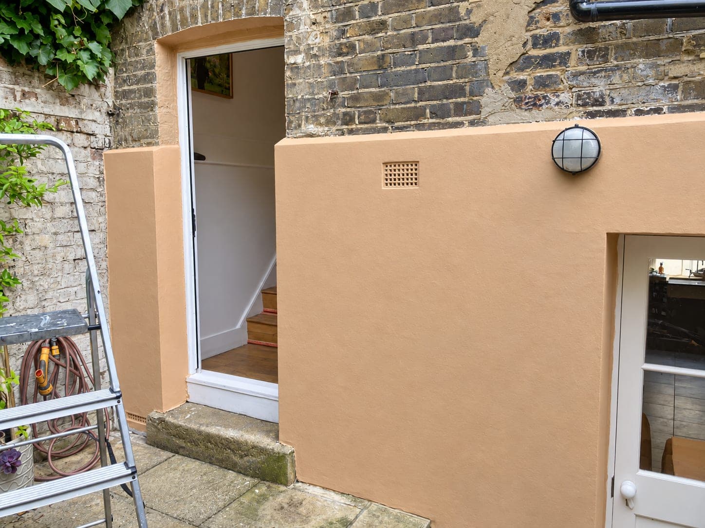 The same lightwell wall finished in a warm lime colour, Shepherdess Walk N1
