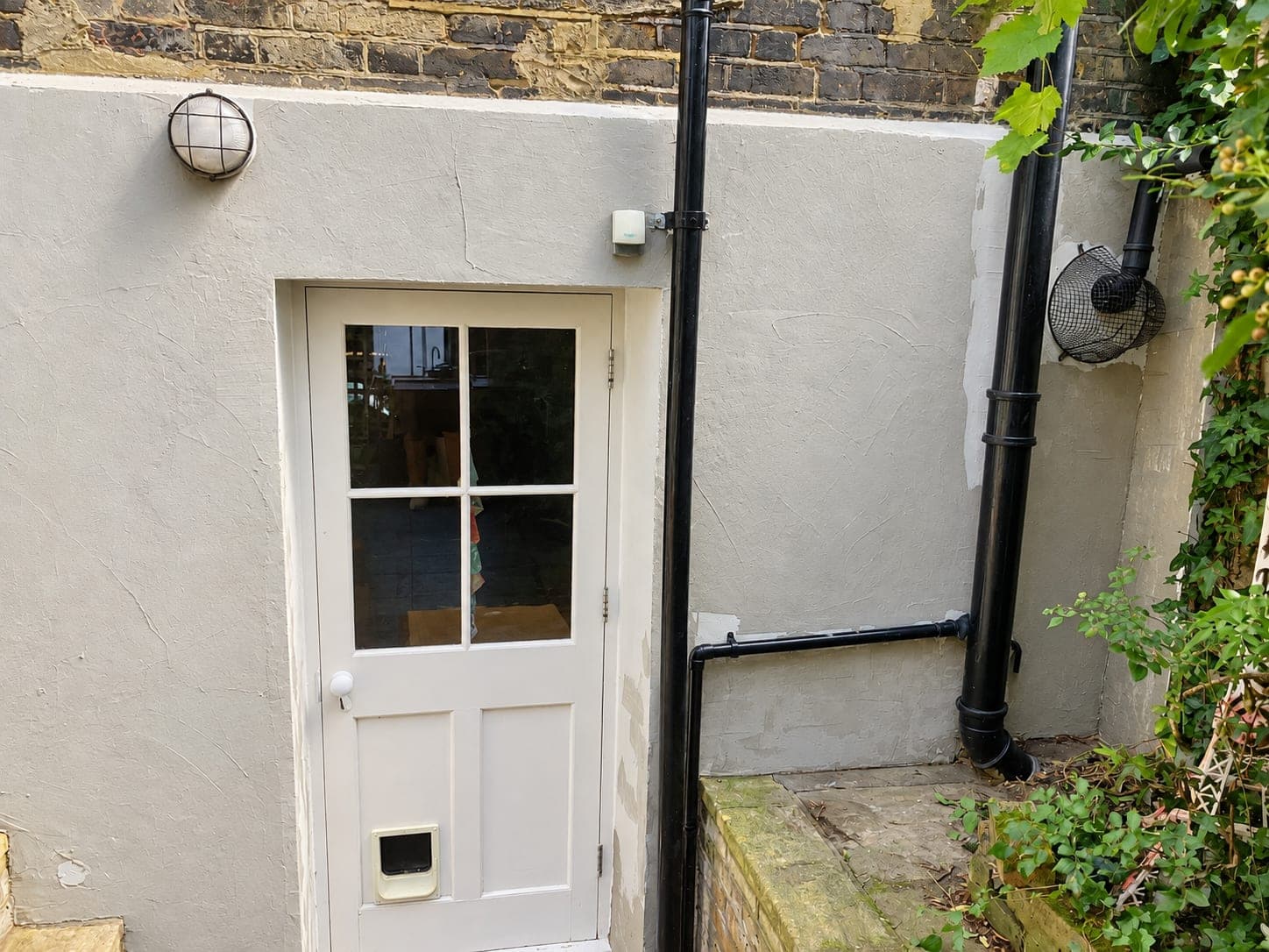 The lightwell seen from the other side in grey base coat, Shepherdess Walk N1