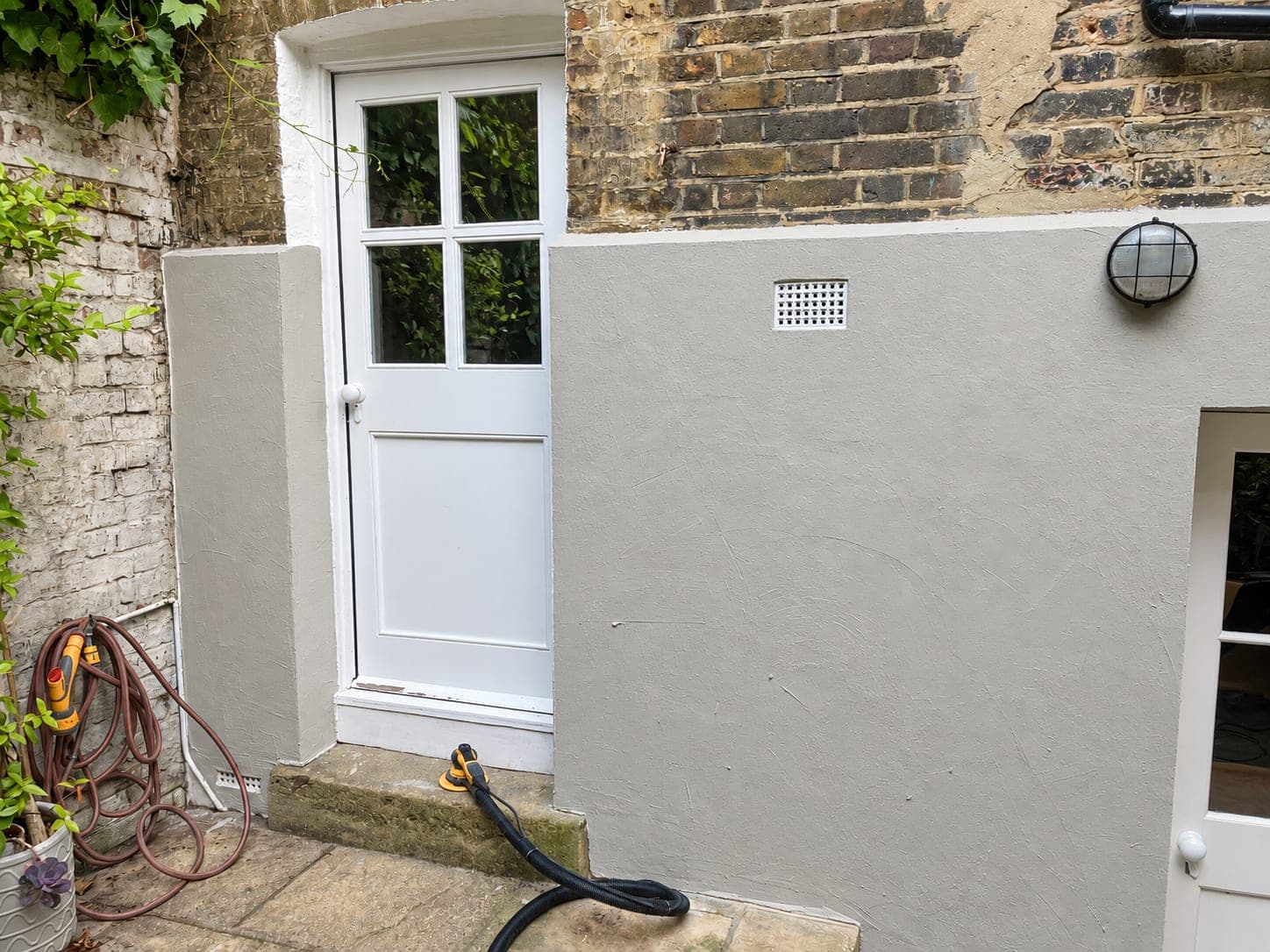 Rear lightwell wall in grey base coat before the colour went on, Shepherdess Walk N1