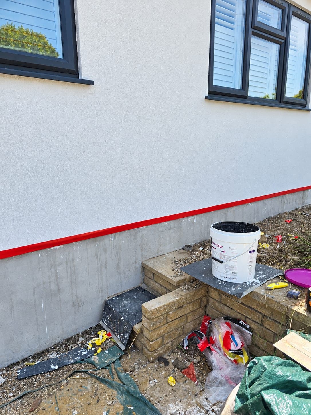 Masking tape along the plinth line before the second colour goes on, Bricket Wood AL2