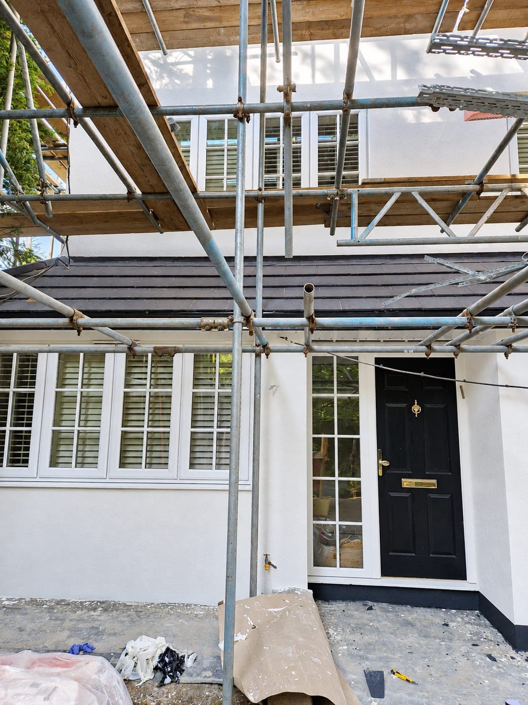 Render complete around the windows and entrance, Enfield EN3