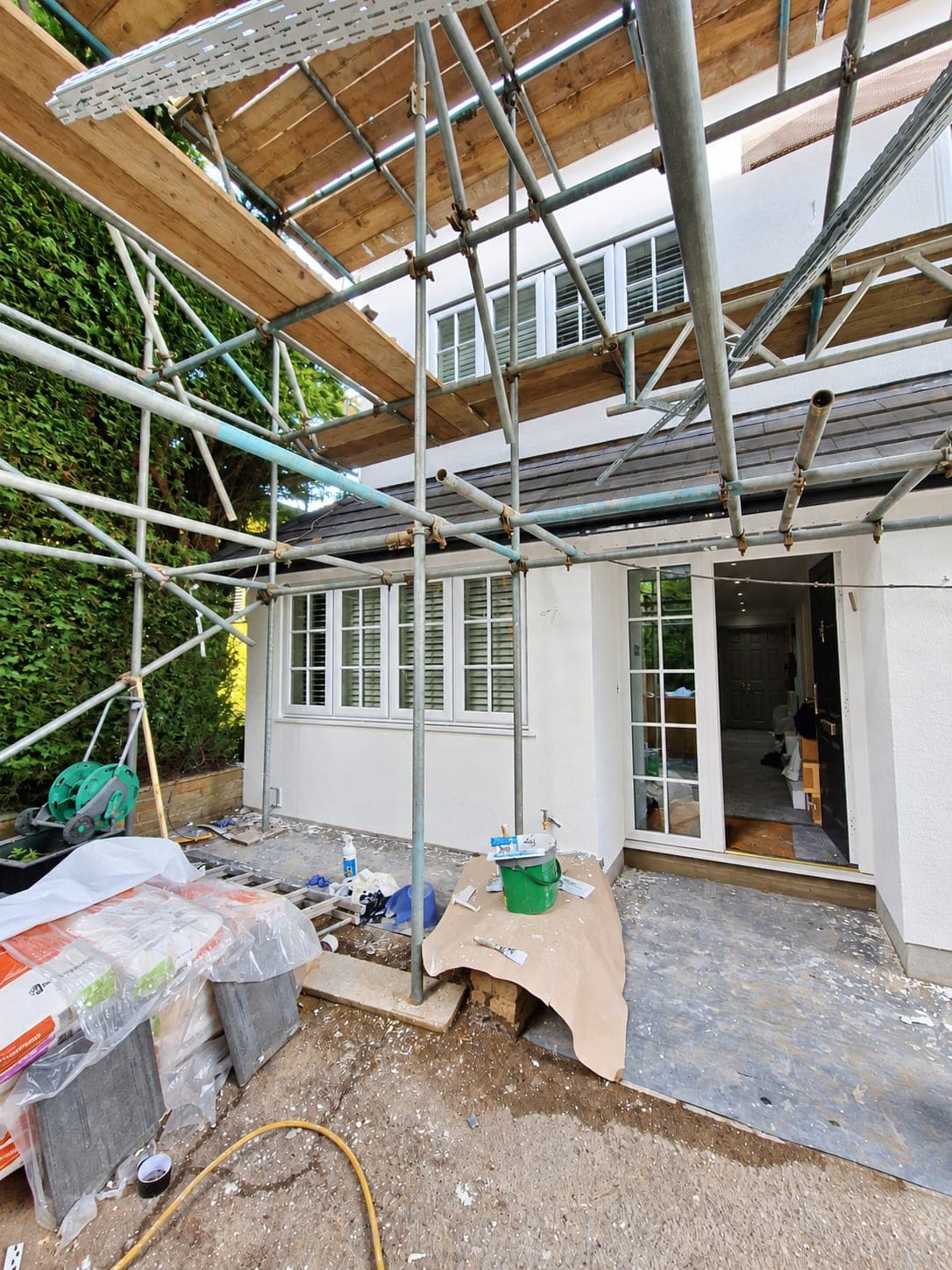 Rendered rear with the french doors and shutters behind, Enfield EN3