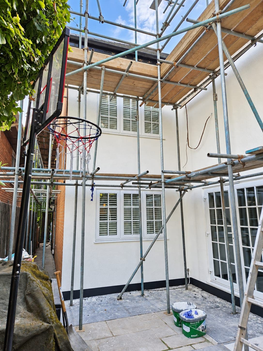 Scaffolded elevation with the render complete, Enfield EN3