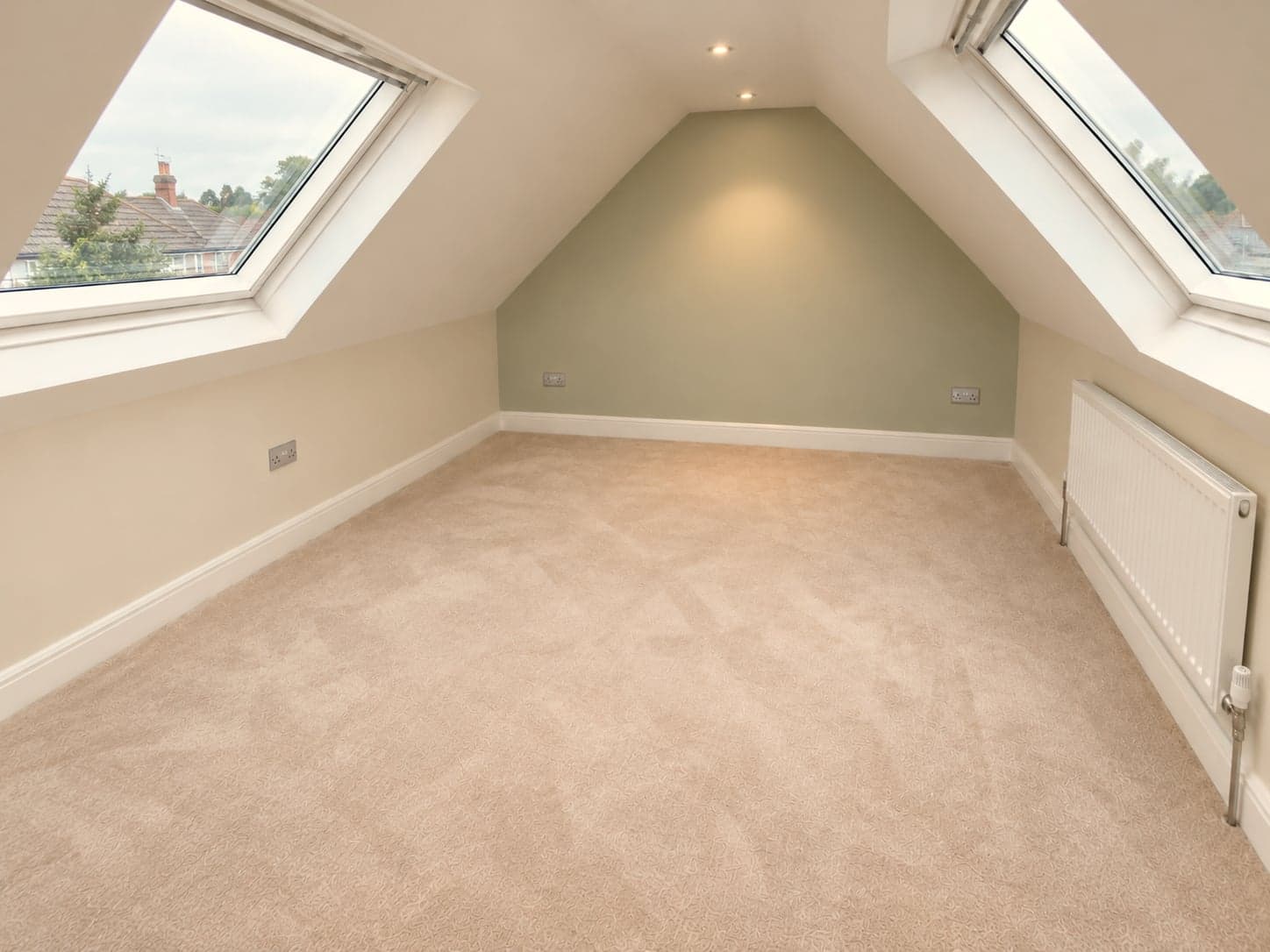 Both roof windows and the sage feature wall seen from the centre of the room, Barnet EN5