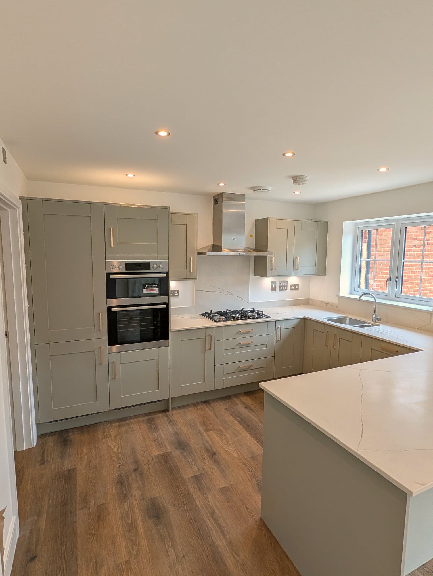 Kitchen from the hall with the oven tower, hob run and peninsula, Chiswick W4