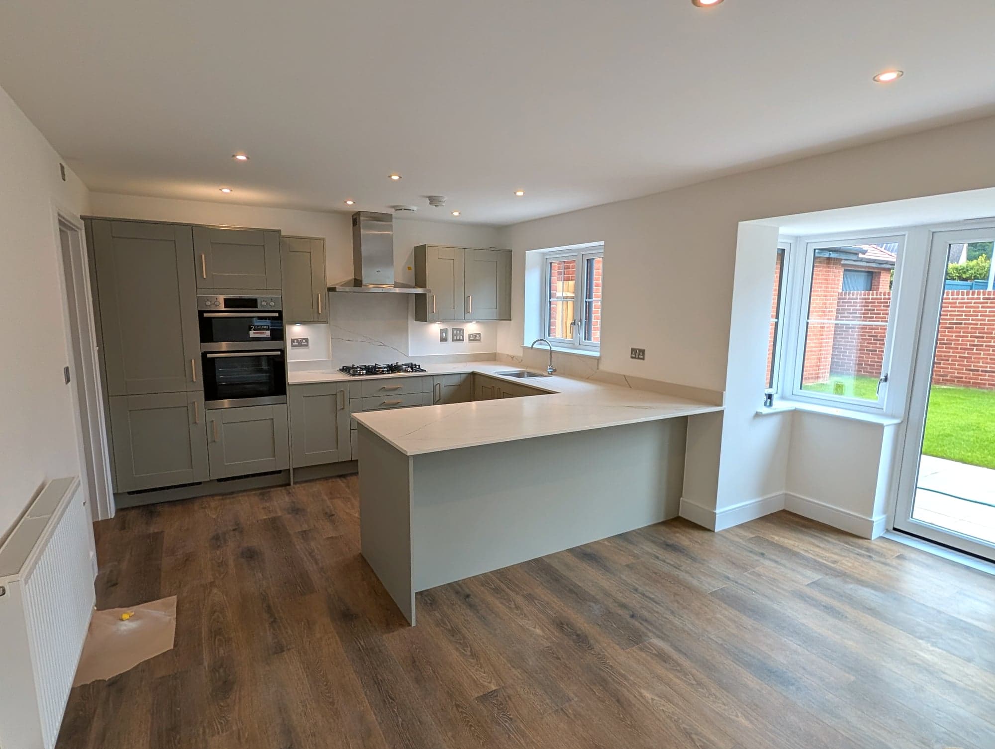 Open-plan kitchen looking through to the garden doors, Chiswick W4