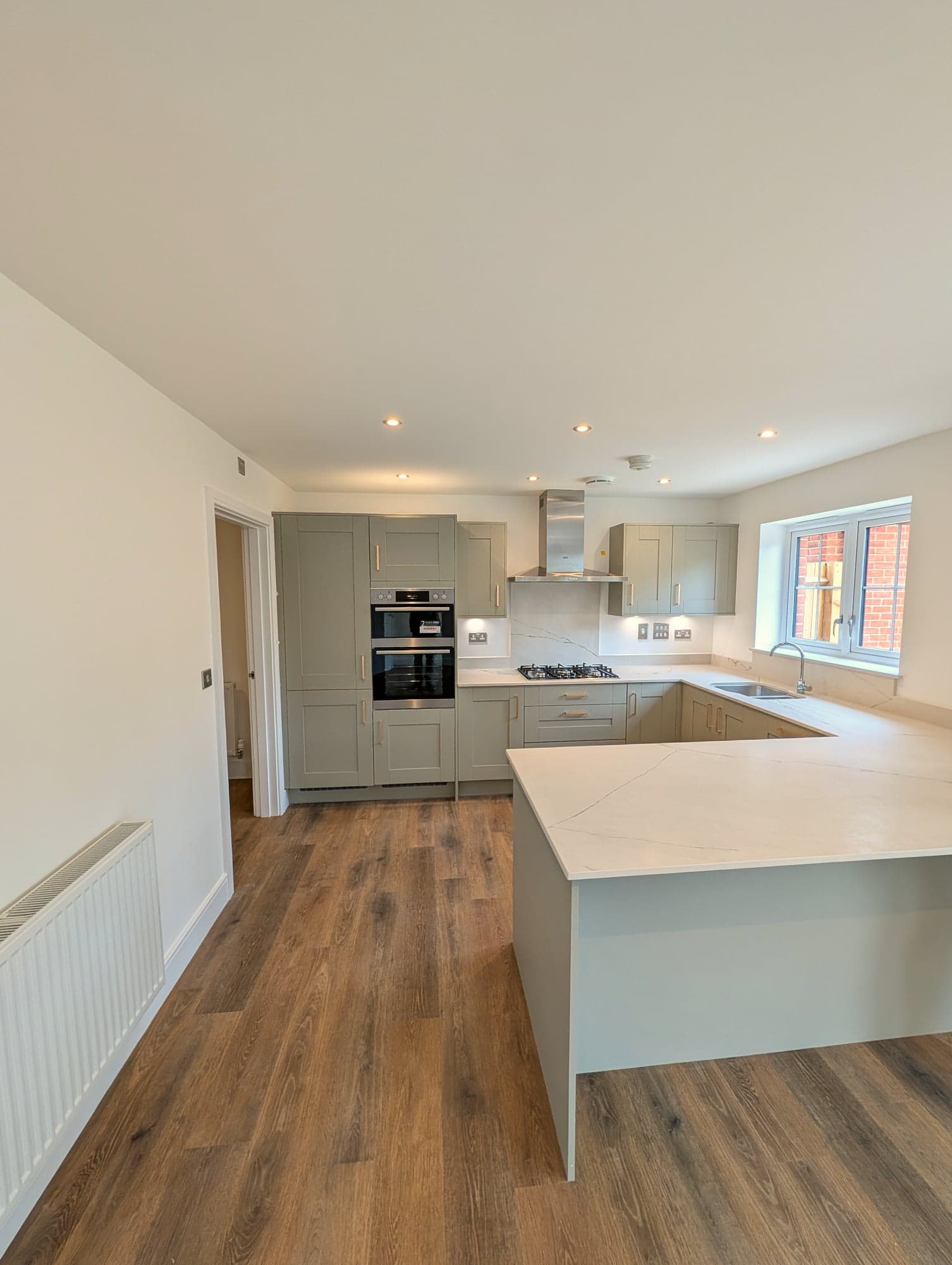 Kitchen and peninsula seen from the dining end of the room, Chiswick W4