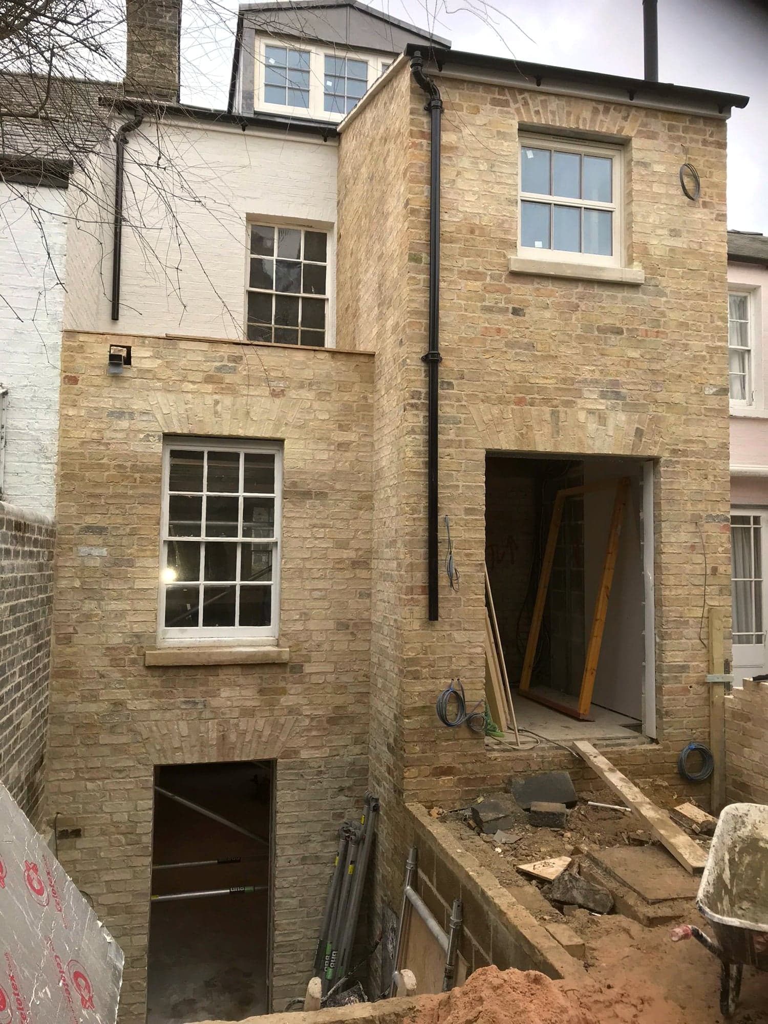 New stone facing and window openings formed on the rear elevation, Kensington W8