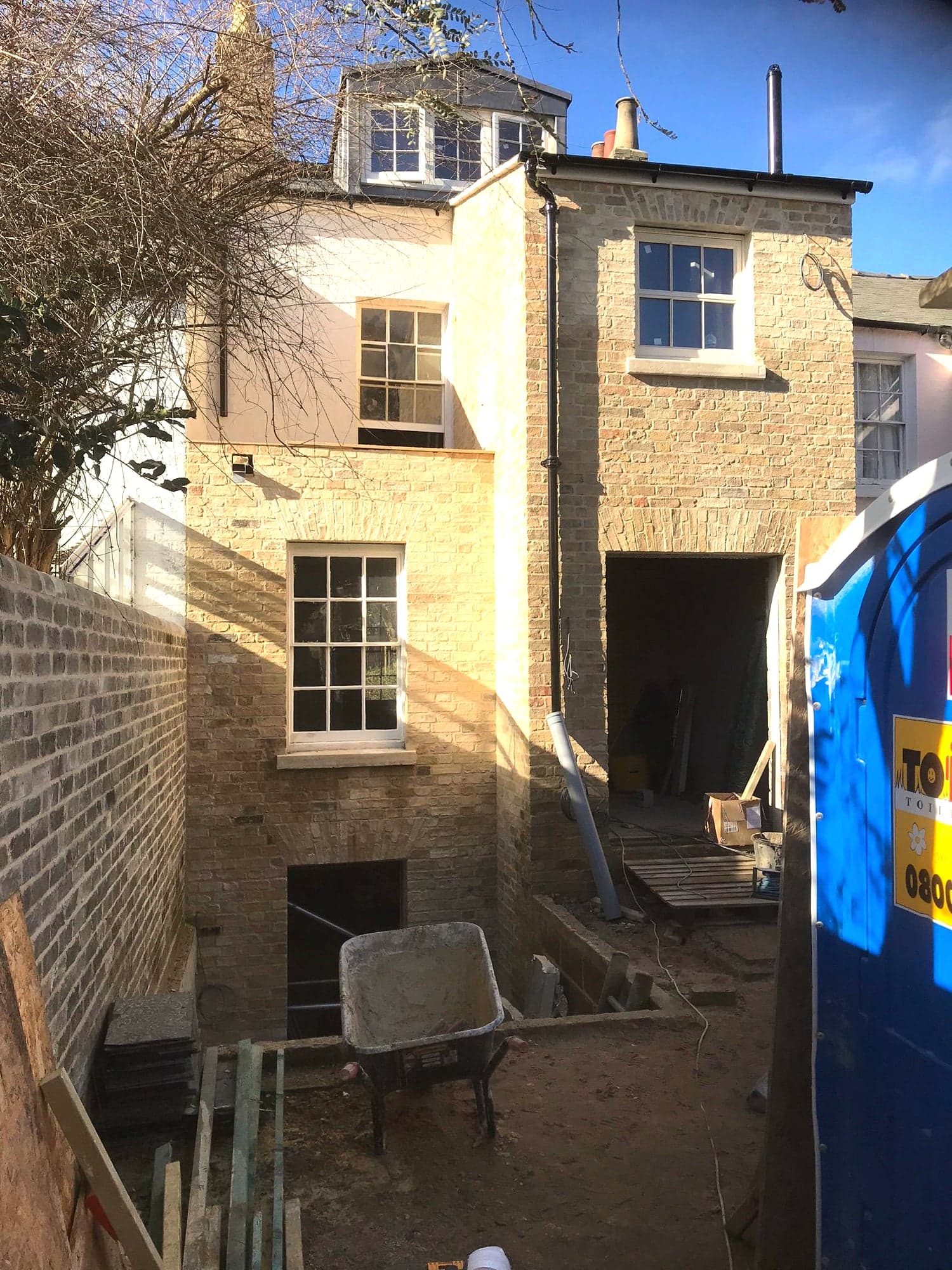 Site view of the extension with the courtyard dug and shoring in place, Kensington W8