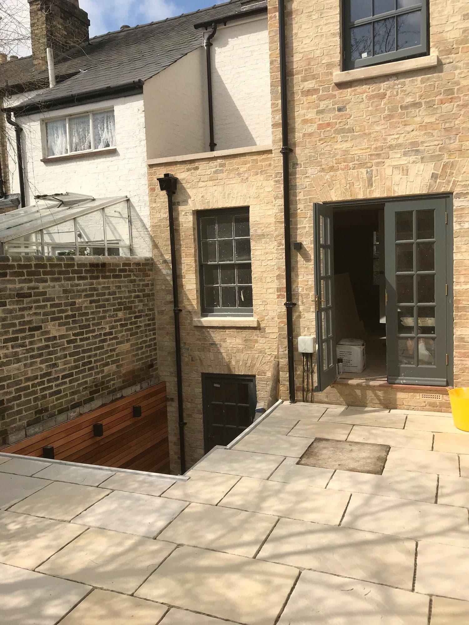 Completed courtyard paving and new door at lower ground level, Kensington W8