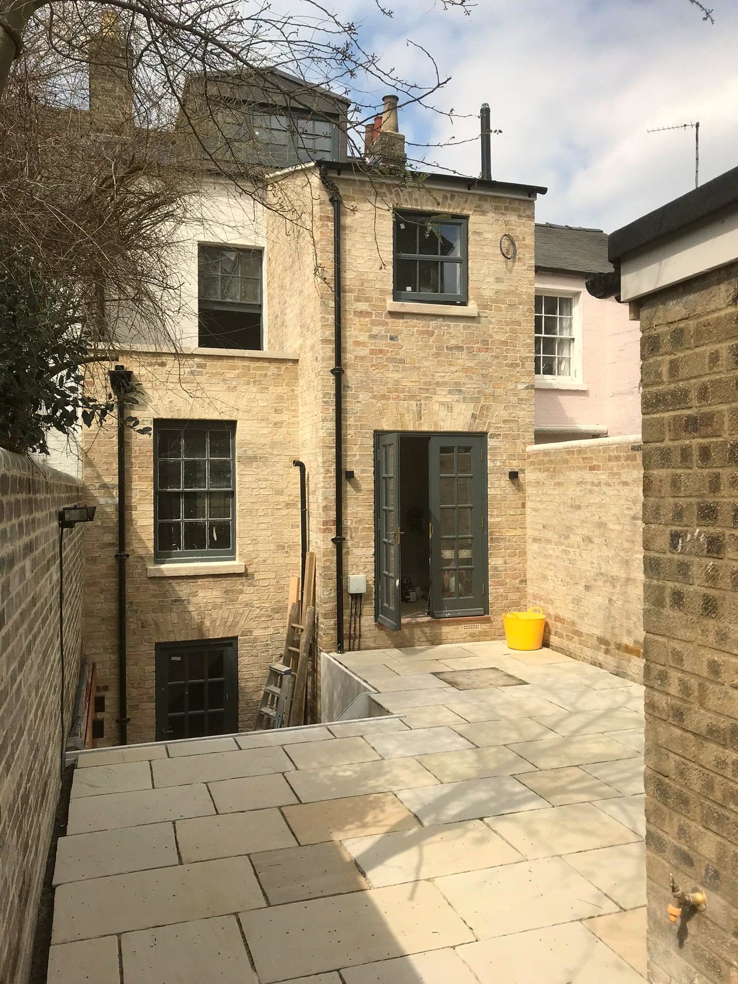Finished stone elevation and York stone courtyard paving, Kensington W8