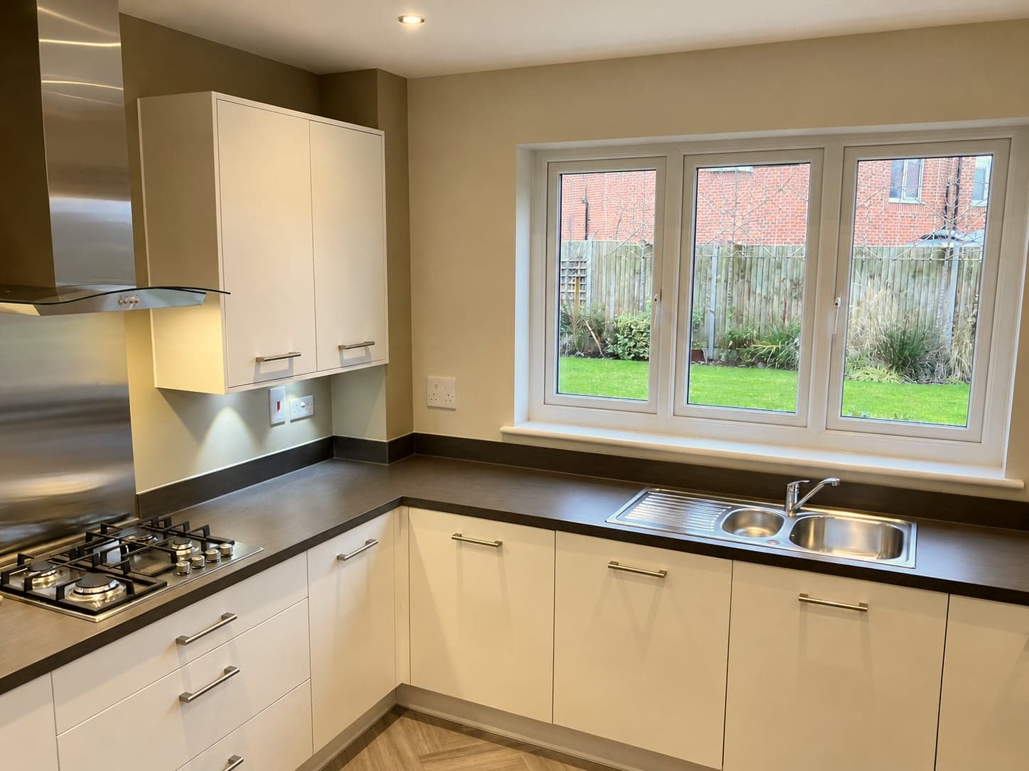 Hob run and sink below the window with under-cabinet lighting, St Albans AL1