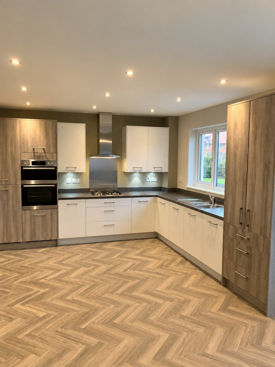 L-shaped layout with oven tower, hob and sink run in one view, St Albans AL1